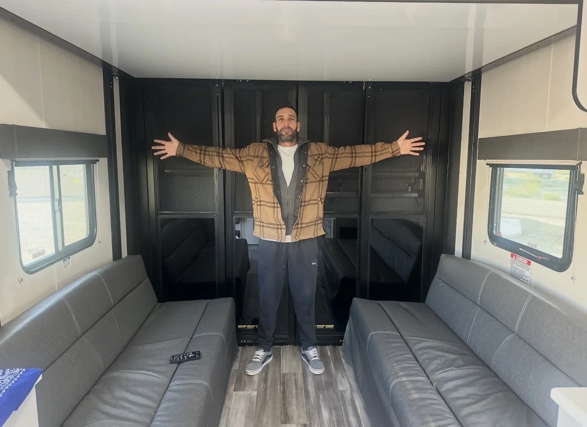 Dennis showing how wide our tailer is