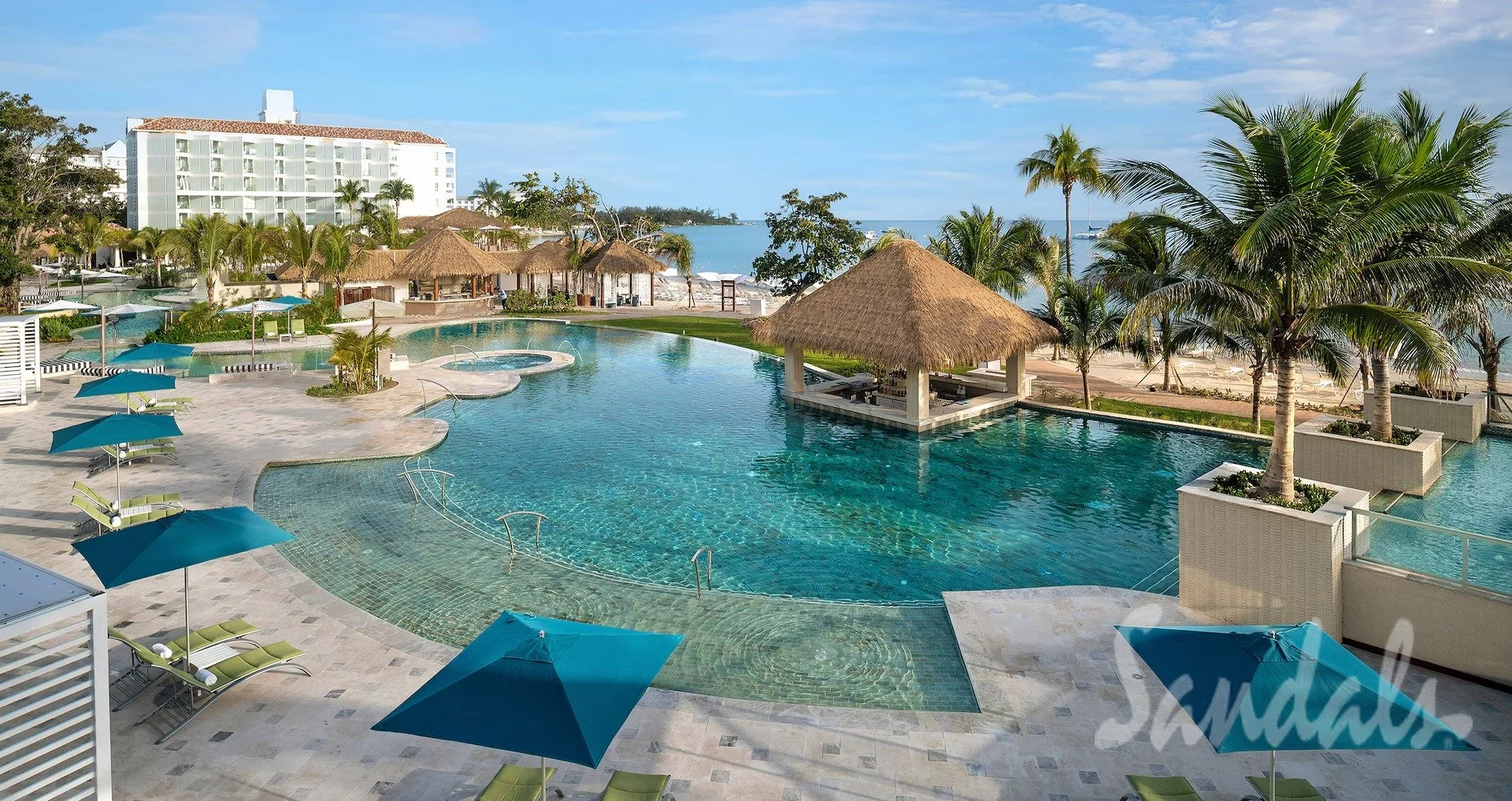 Sandals Dunn's River resort lobby with cascading waterfall feature and tropical garden, Ocho Rios, Jamaica