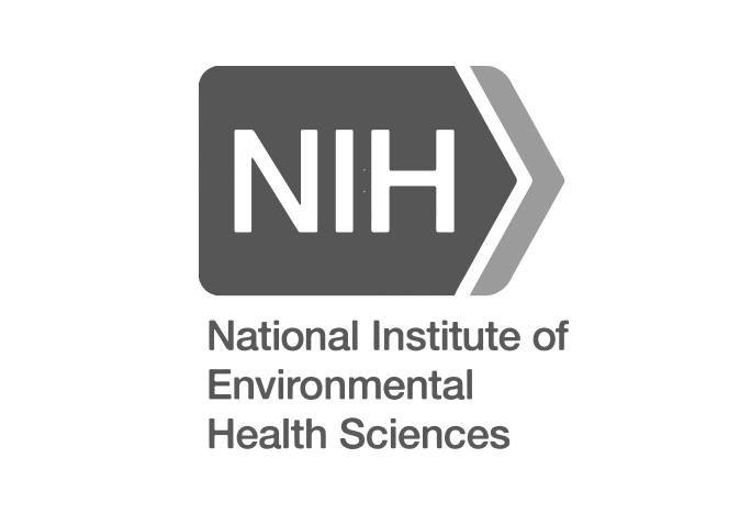 Logo of the National Institute of Environmental Health Sciences with a hexagonal shape containing 'NH' and an arrow, accompanied by the text 'National Institute of Environmental Health Sciences' in black.