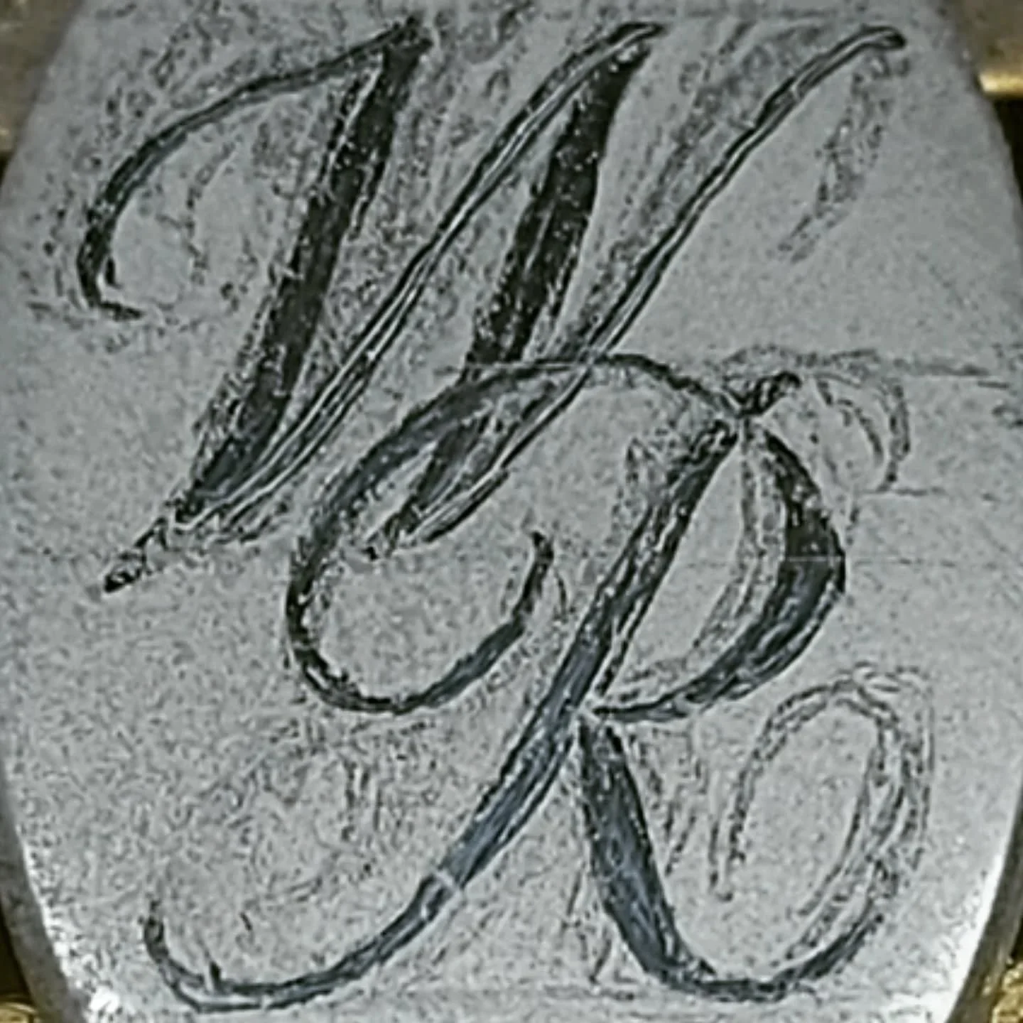 These silver, oval shape cufflinks were sent in for engraving. You can see the faded initial designs have been carefully drawn on and corrected, ready for the engraving process.

#silver #gold #cufflinks #wedding #suit #personalisedcufflinks #persona