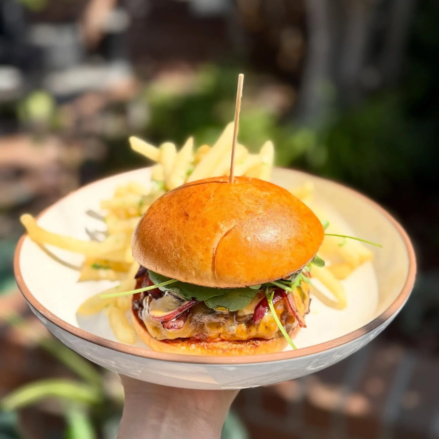 Introducing our NEW Shaken Beef Burger, a bold and flavorful tribute to Chef Helene An and her iconic Shaken Beef.

This burger is packed with all the flavors you know and love: a juicy, flavor-packed beef patty, our house-made tomato jam infused wit