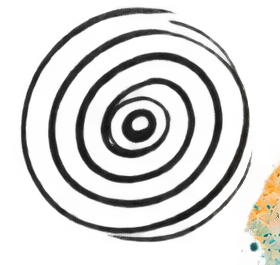 Close-up of a black, spiral-patterned coaster or mat, with colorful scattered confetti or sprinkles to the side.