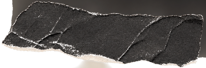 A torn piece of black and white textured paper or material with rough edges and visible creases.