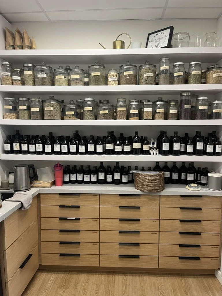 Reception and dispensary of the Annex Naturopathic Clinic at Bloor and Bathurst in Toronto. Custom botanical tinctures and teas, along with professional brand nutraceuticals and supplements, are available to accompany your treatment plan.
