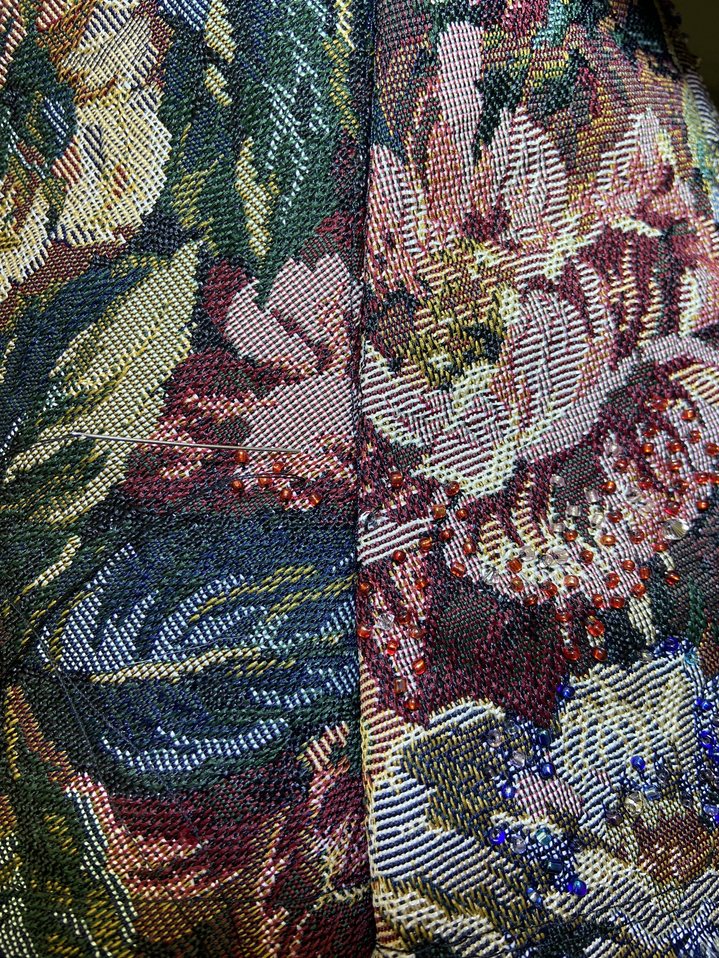 Detailed view of the beaded corset fabric