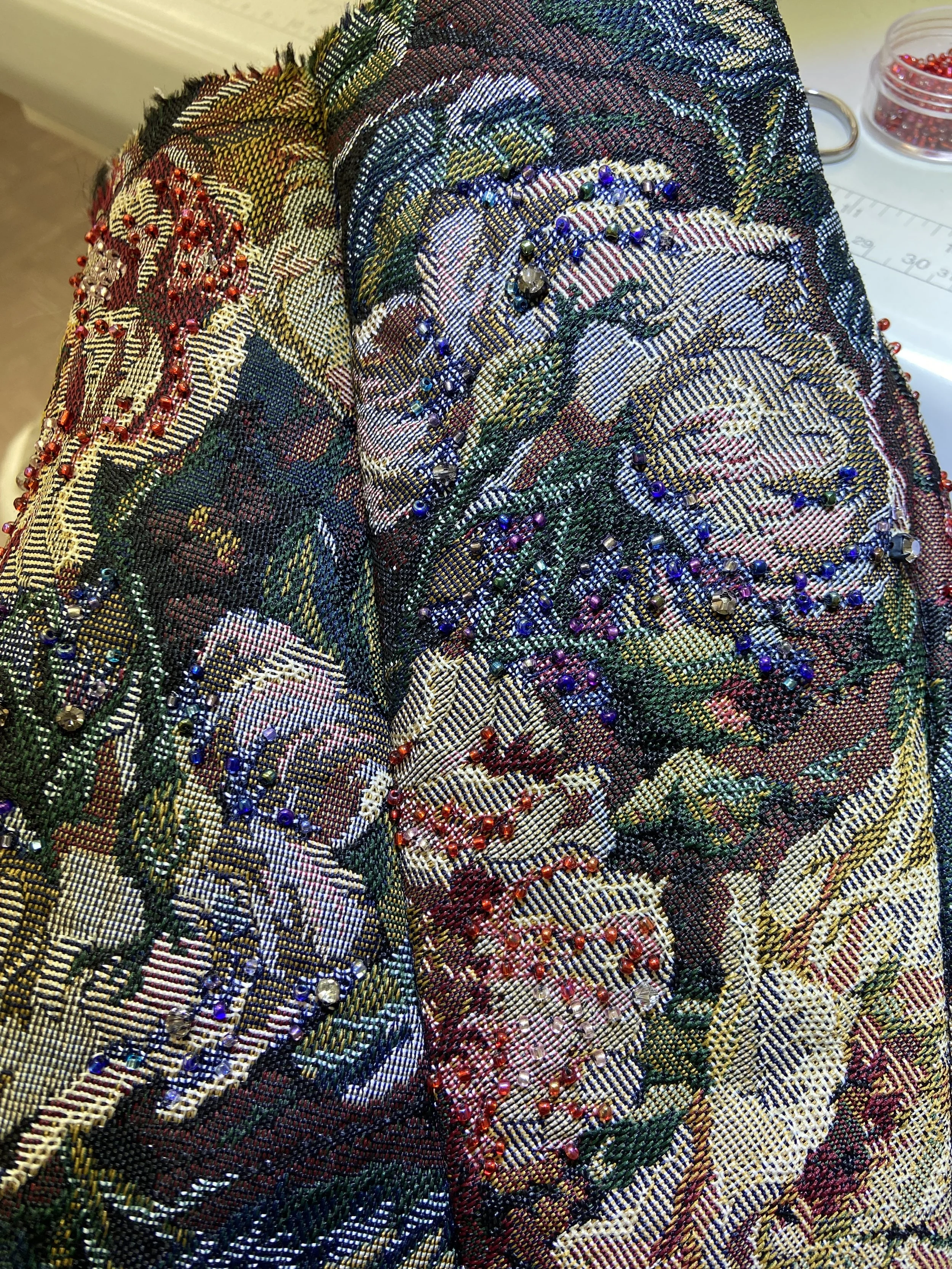 Detailed view of the beaded corset fabric