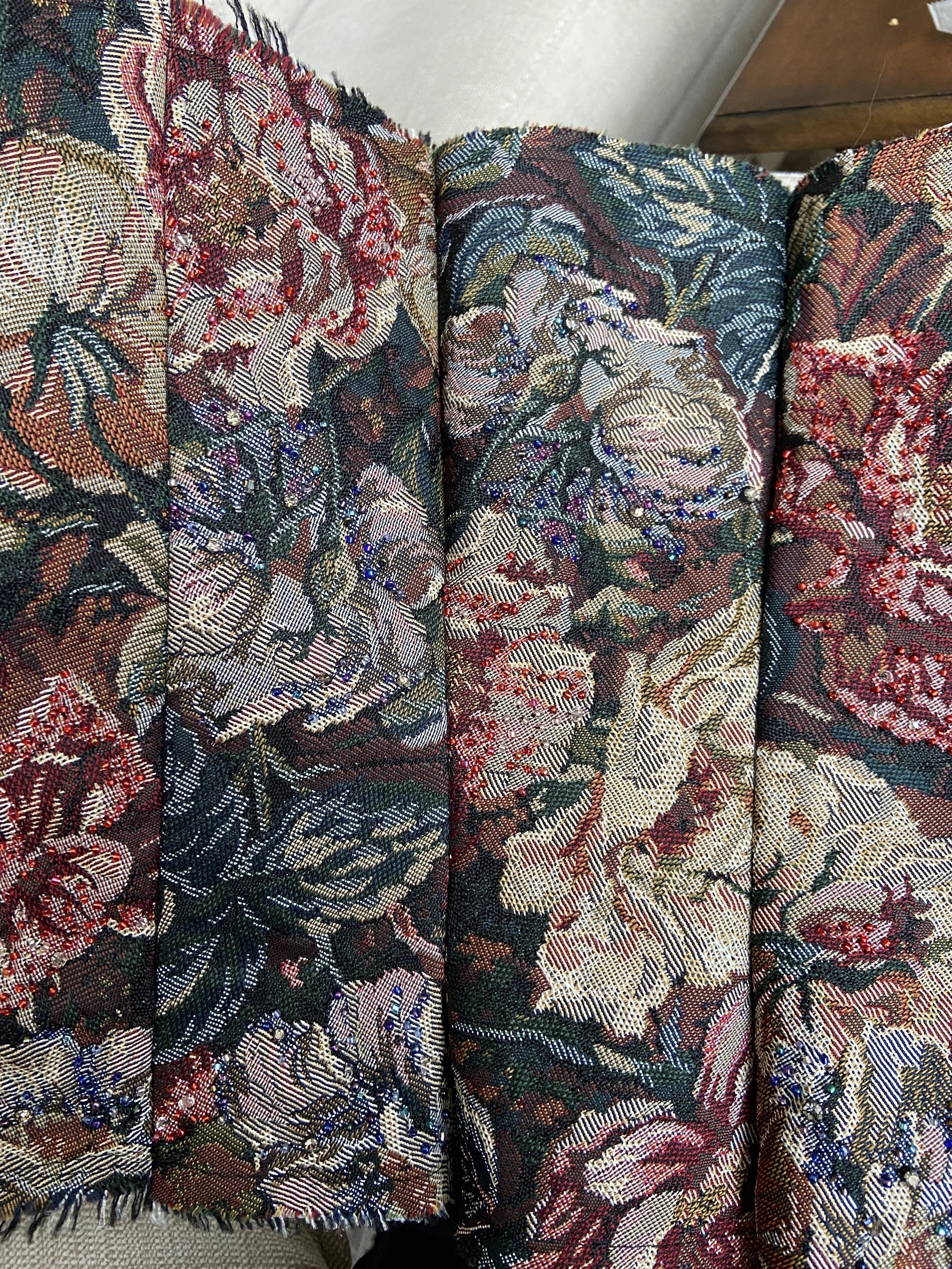 Detailed view of the beaded corset fabric