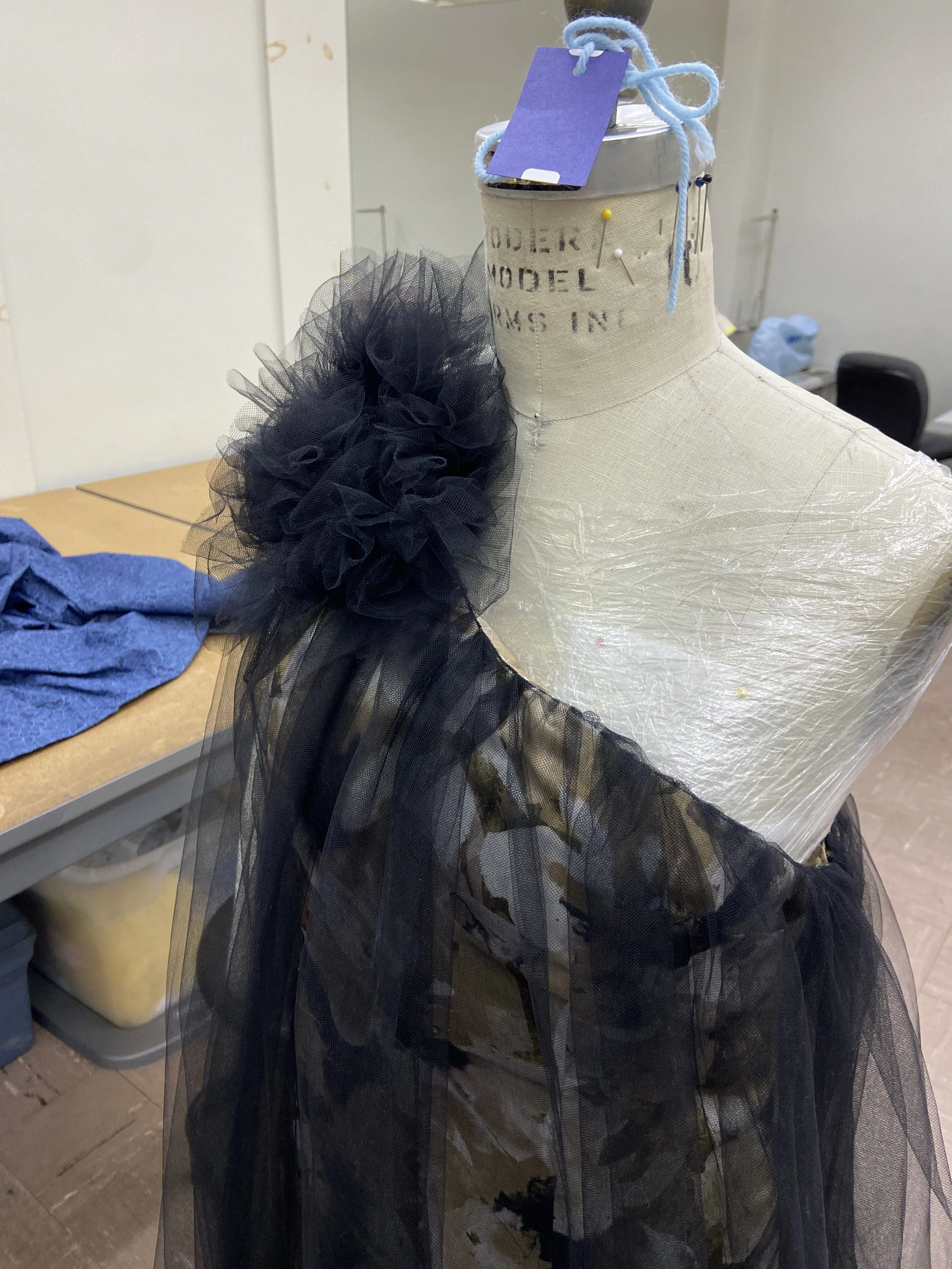 Right side view: The flower was then hand sewn through all layers, besides the lining, to the dress.