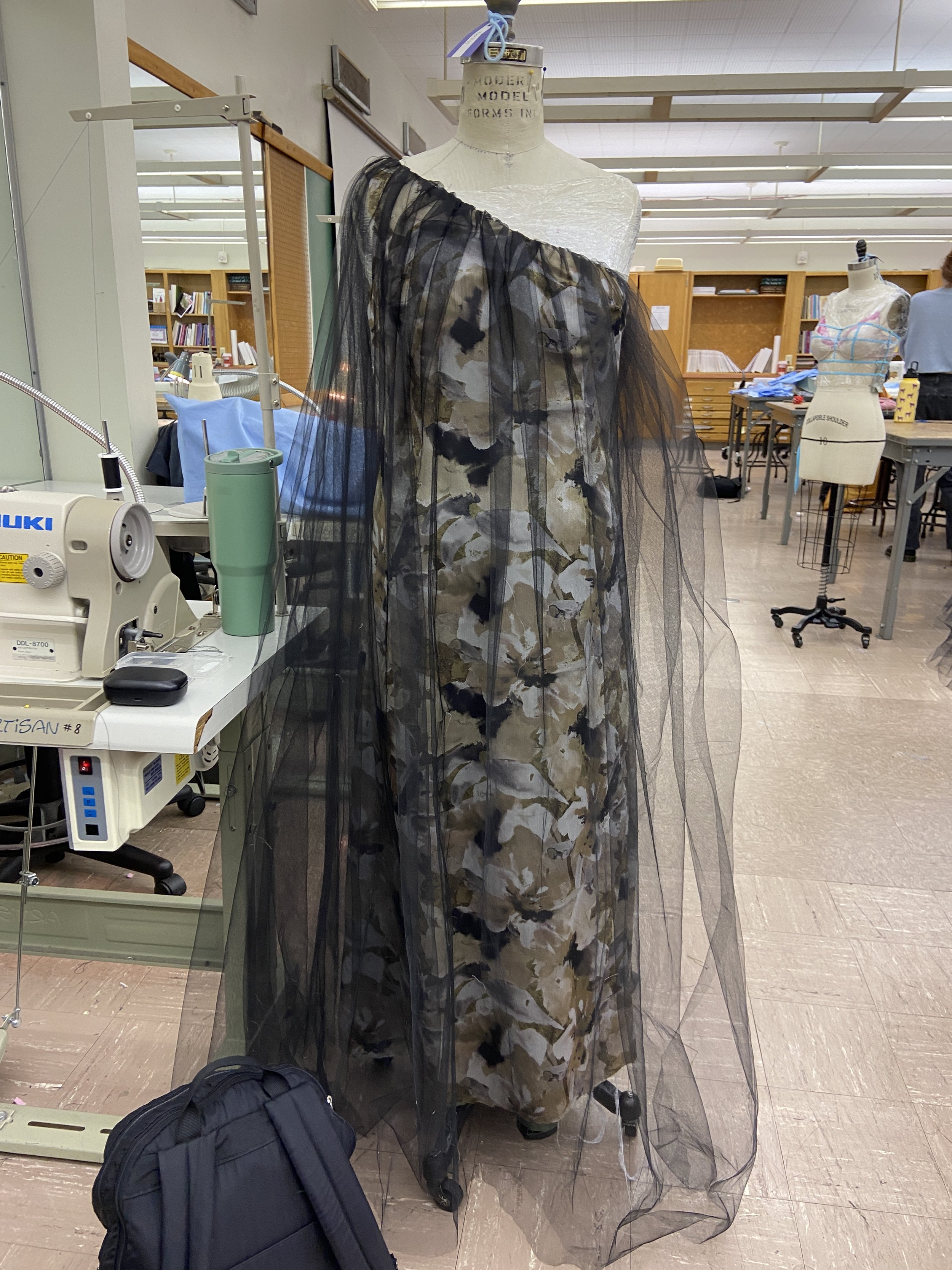 Inner lining, outer fashion fabric, and both layers of tulle are attached at neckline, understitched, and pressed.