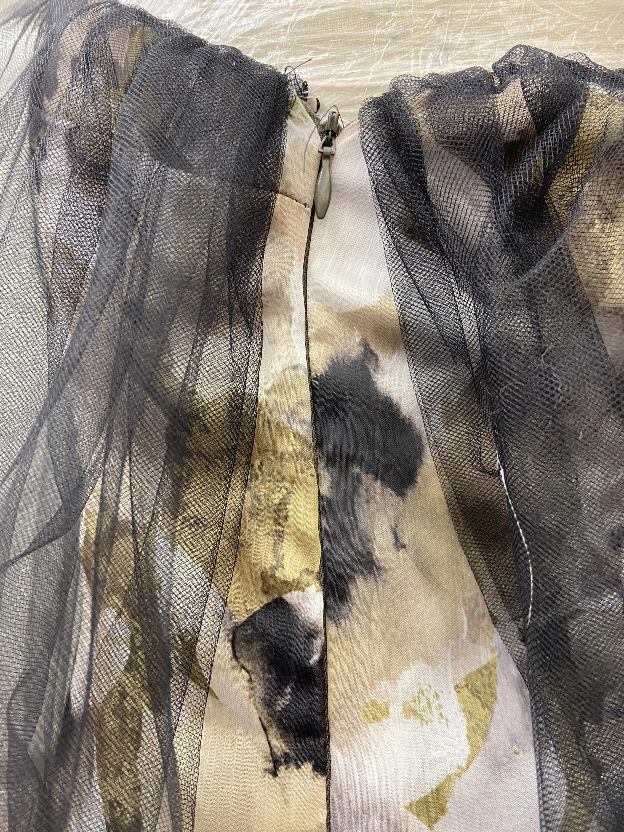 Attaching an invisible zipper to the outer fashion fabric's side seam.