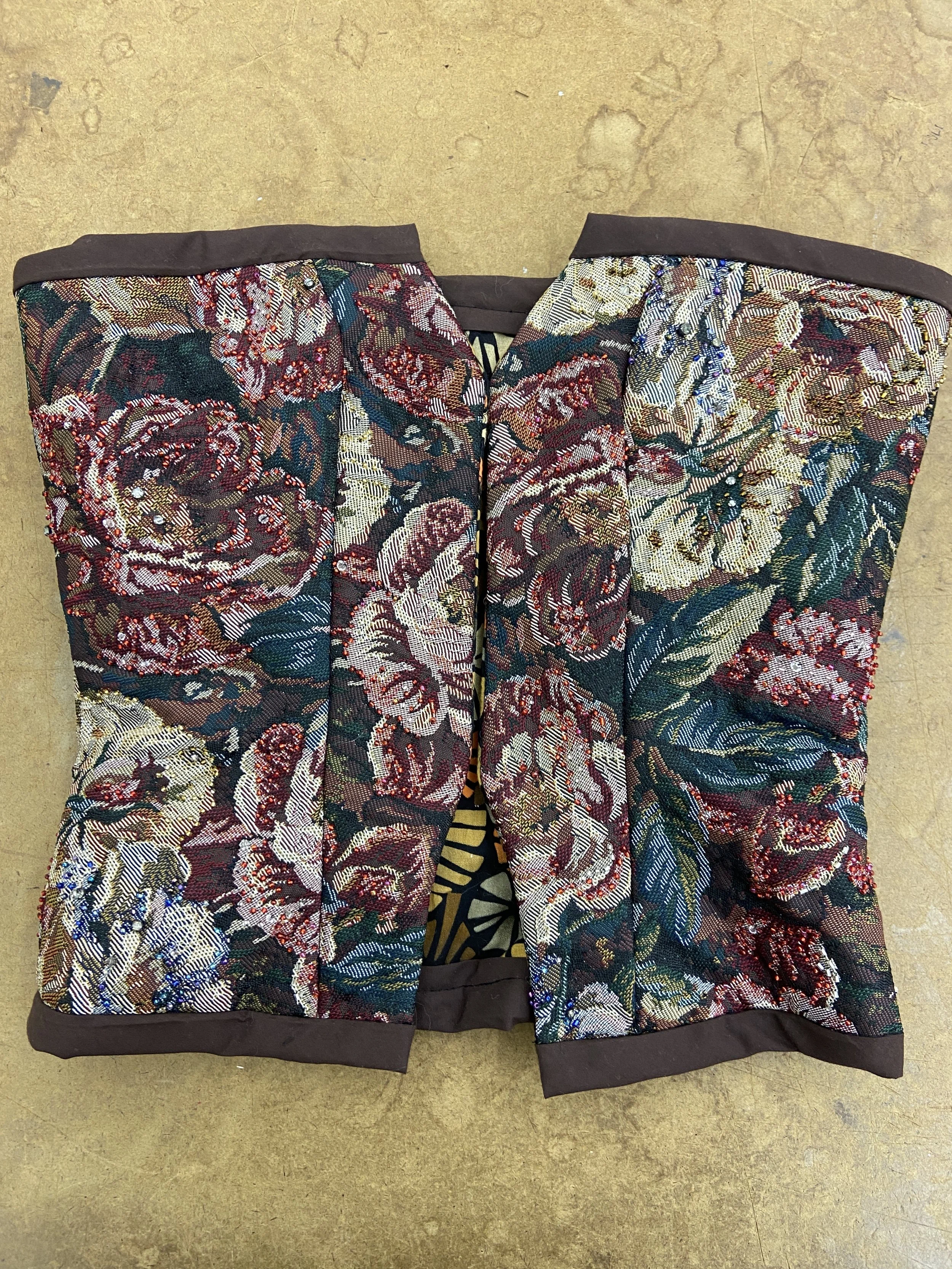 Once bias binding the corset, the next step was installing the grommets