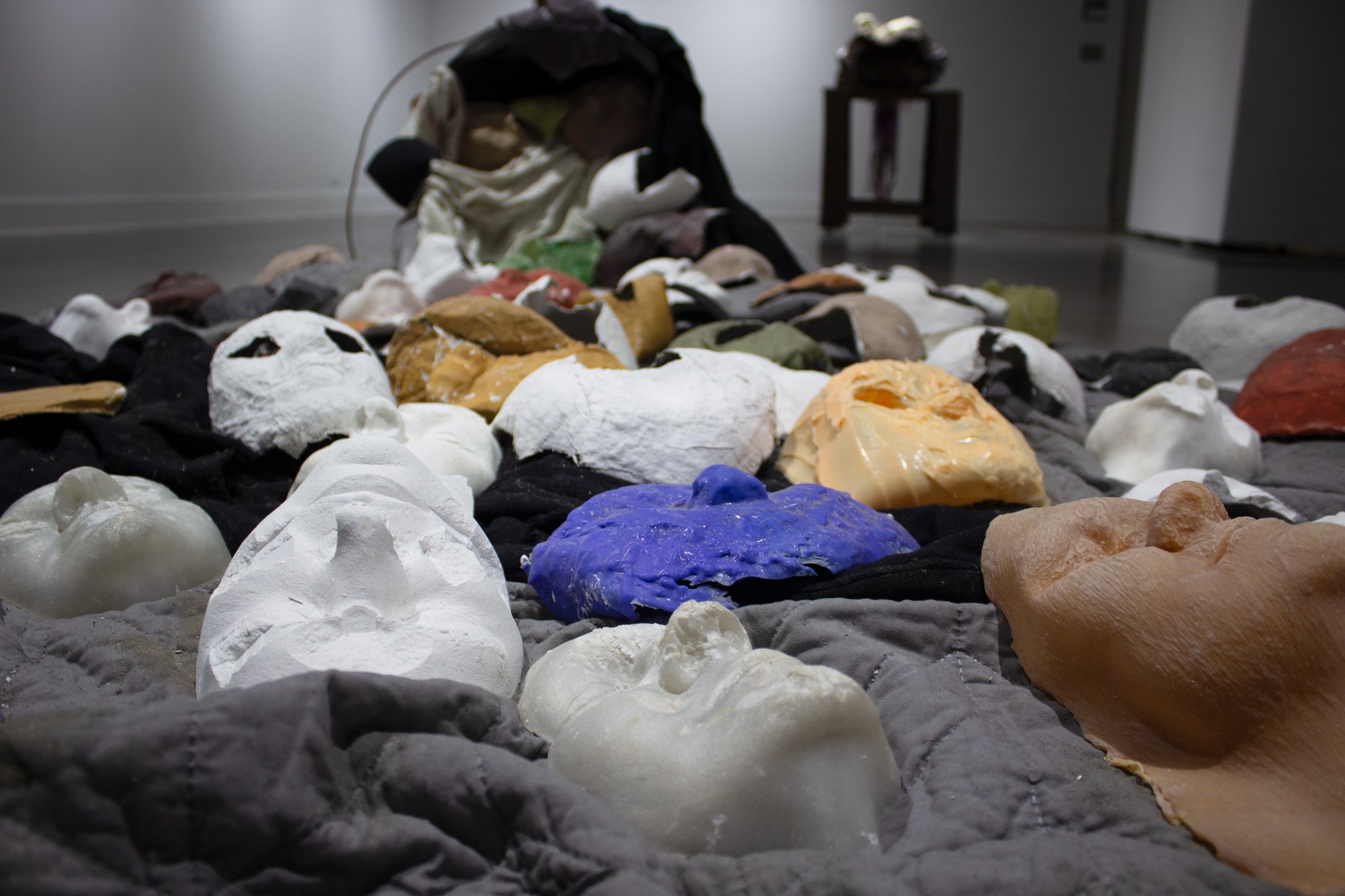 Reveal, 2025.
Metal trash can, plaster, resin, paint, clothes, blankets and boxes.
98 x 54 x 24 inches.
