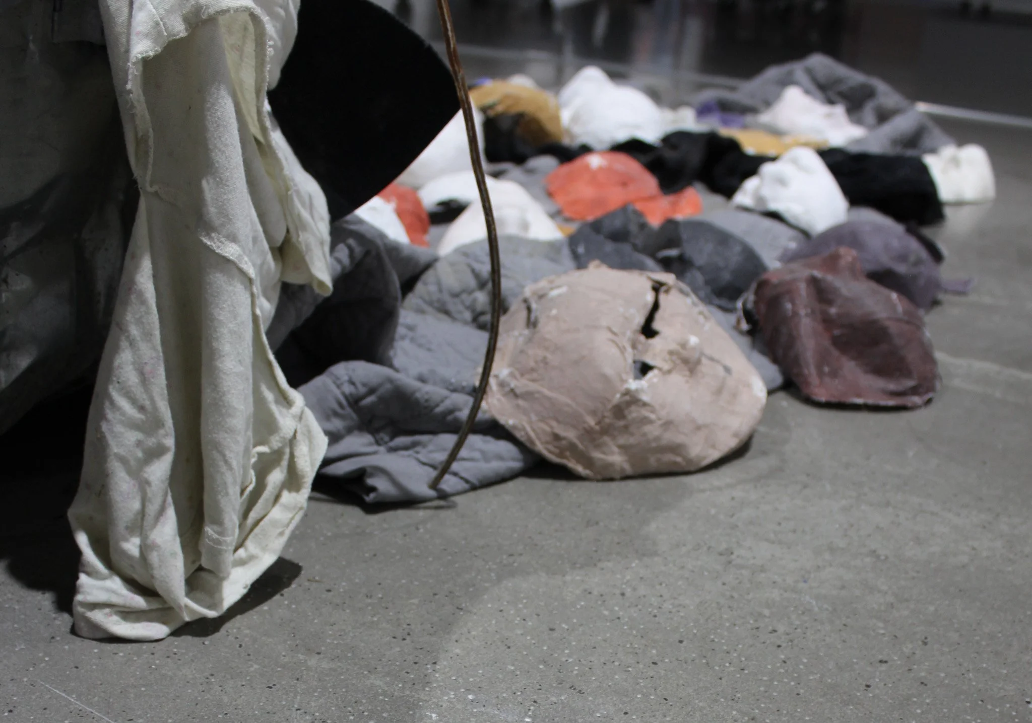 Reveal, 2025.
Metal trash can, plaster, resin, paint, clothes, blankets and boxes.
98 x 54 x 24 inches.
