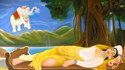 A woman in yellow clothing lying on a bed outdoors with a large tree beside her, and an animated elephant spraying water in the background against a blue sky with clouds.