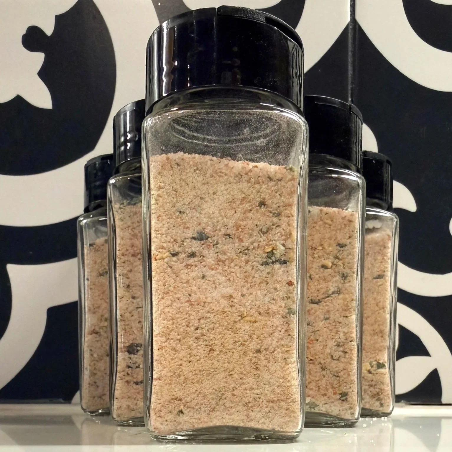 Jalapeño salt in a 4 ounce bottle with butterfly lid.