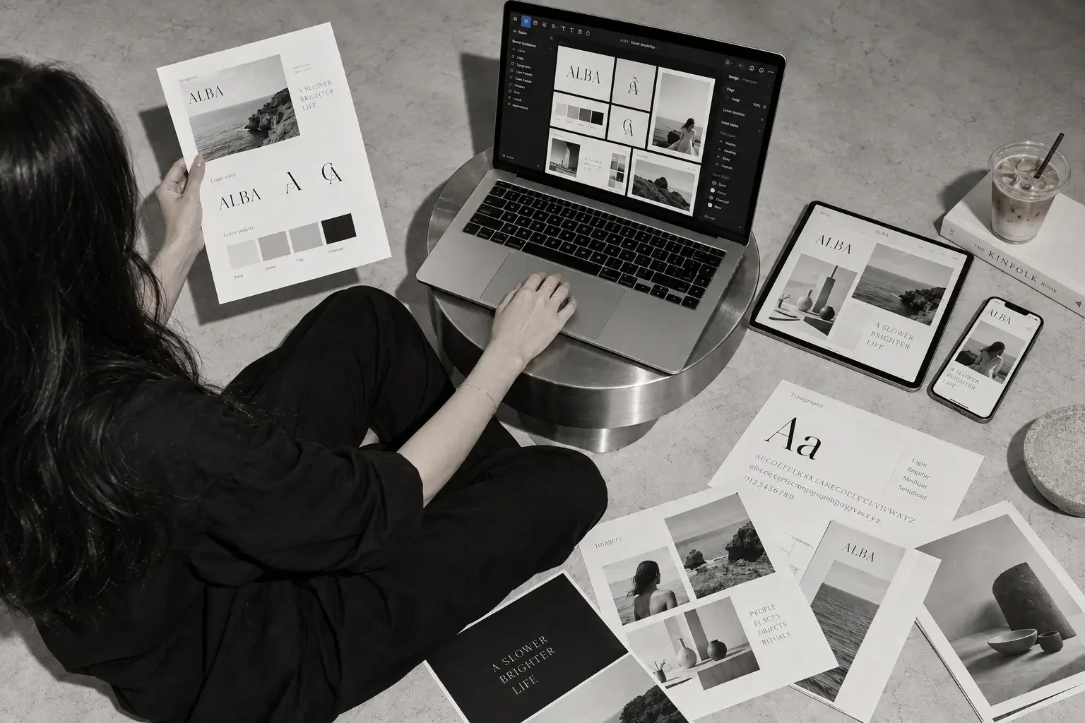woman siting on ground working on brand project by 808 design studio