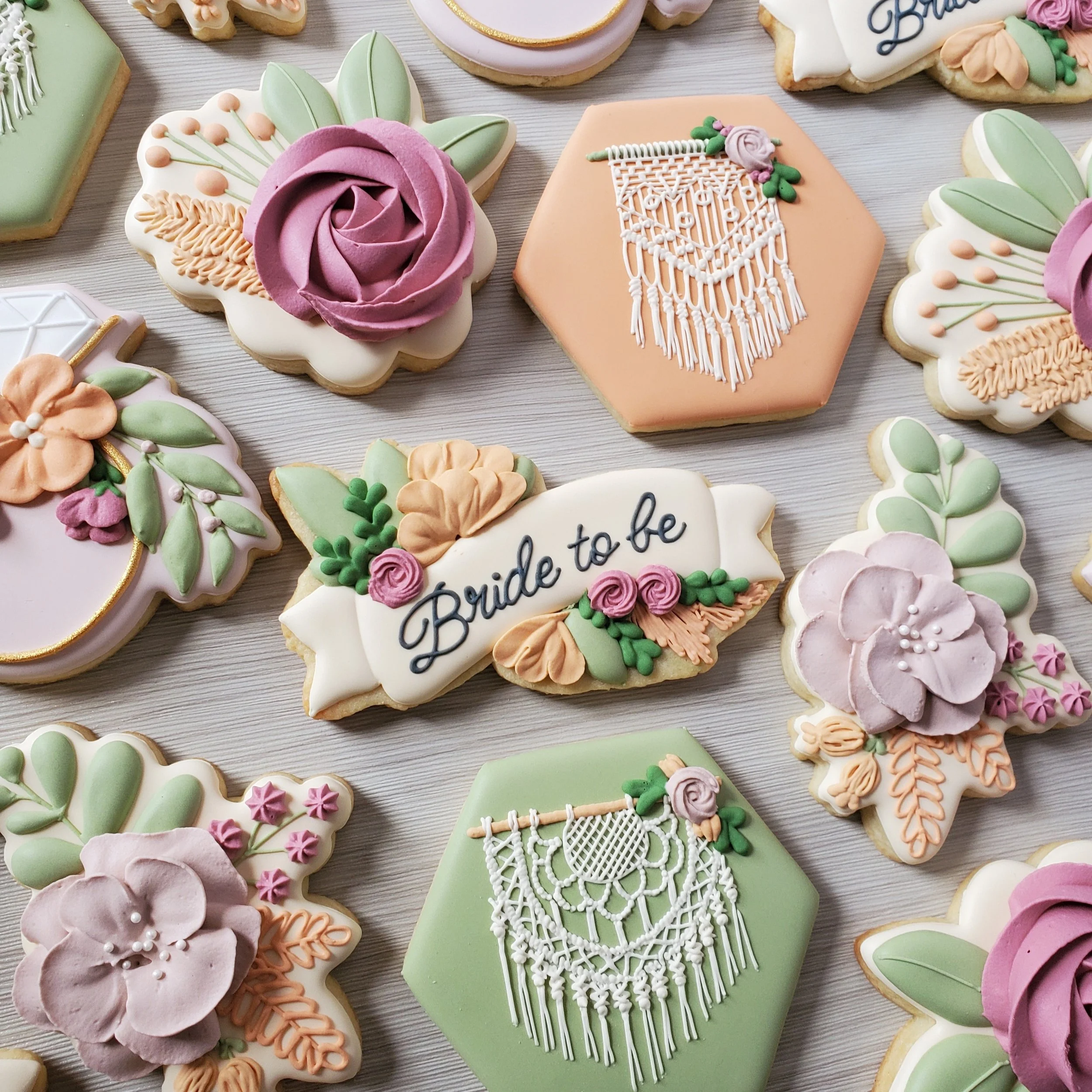 Decorated cookies with floral, lace, and bride-to-be themes, including one with the text 'Bride to be'.