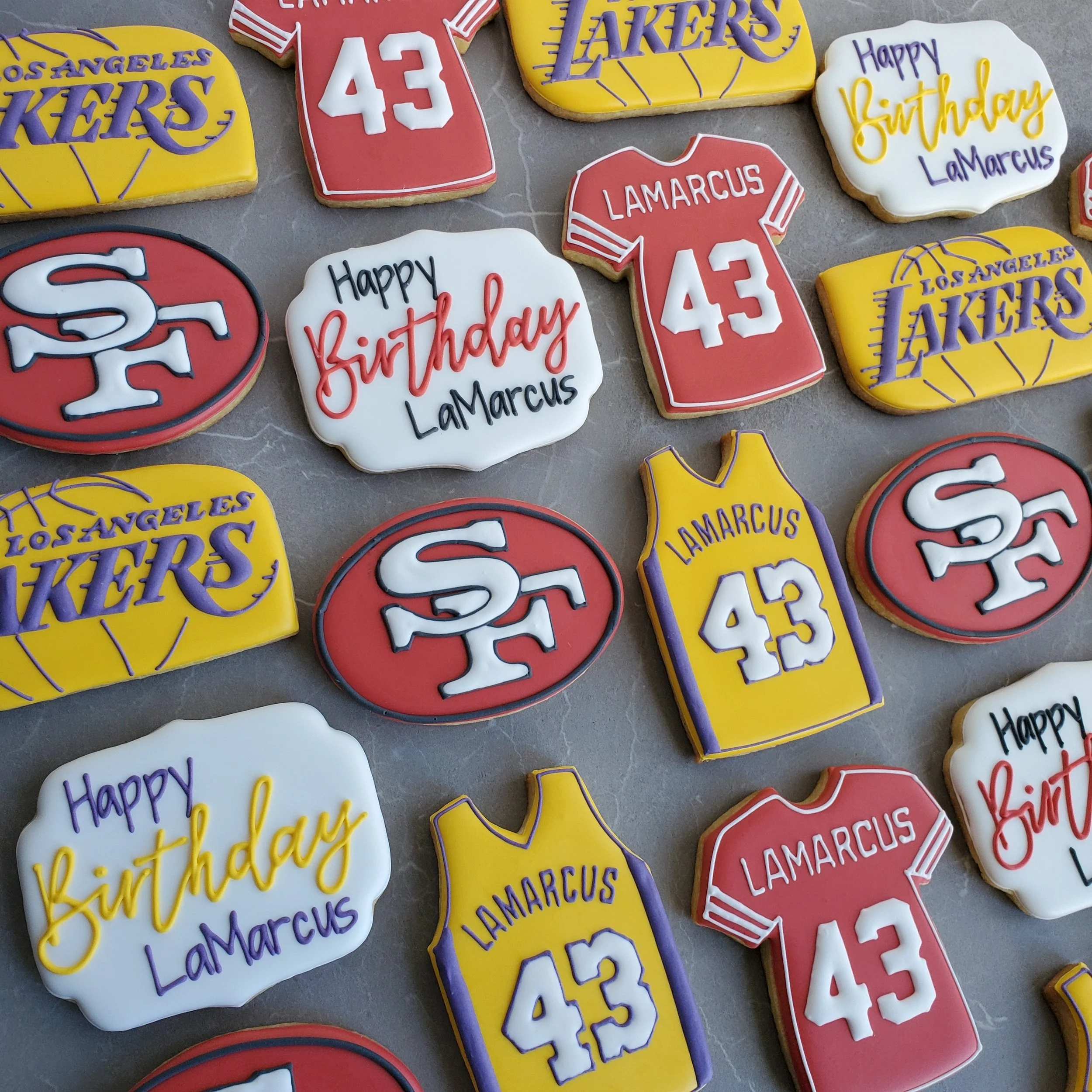 Decorative cookies celebrating LeBron James' birthday, featuring LA Lakers jerseys, San Francisco 49ers logos, and birthday messages.