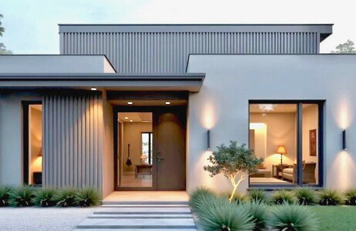 Modern house with minimalist design, large glass doors, porch lighting, and landscaped garden.