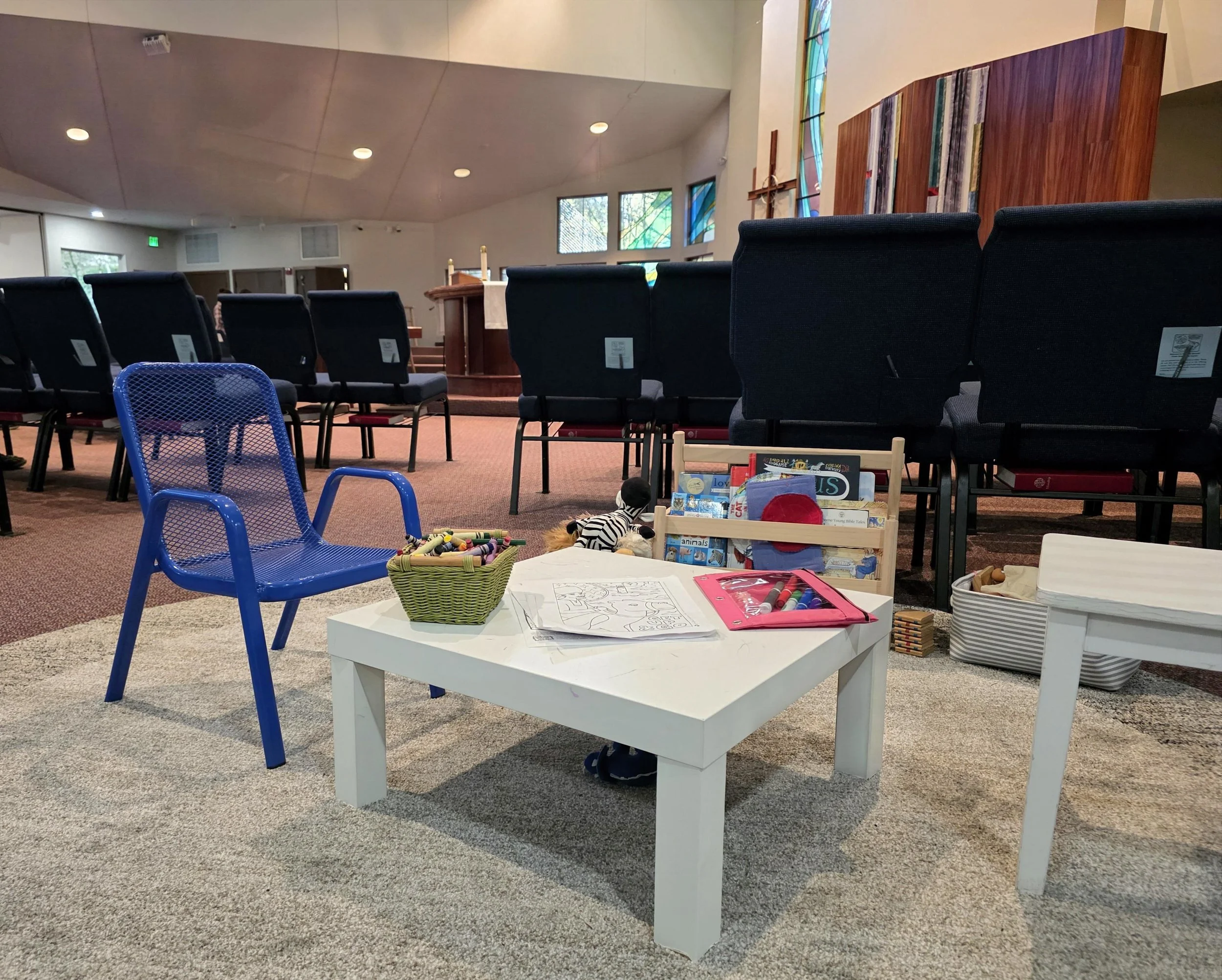 Little ones can quietly play during worship in the designated area of the sanctuary.