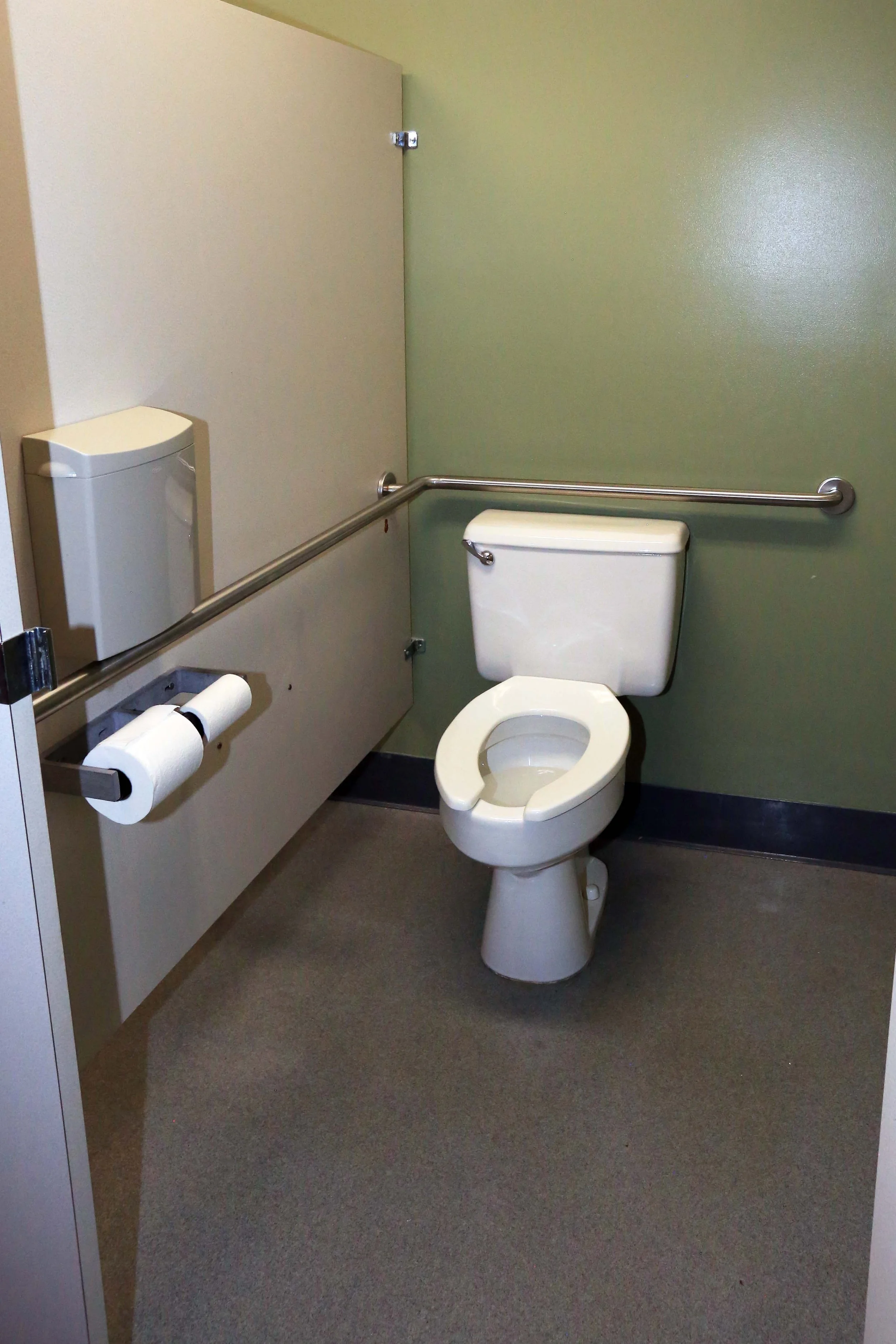 Restrooms have wheelchair-accessible stalls with grab rails.