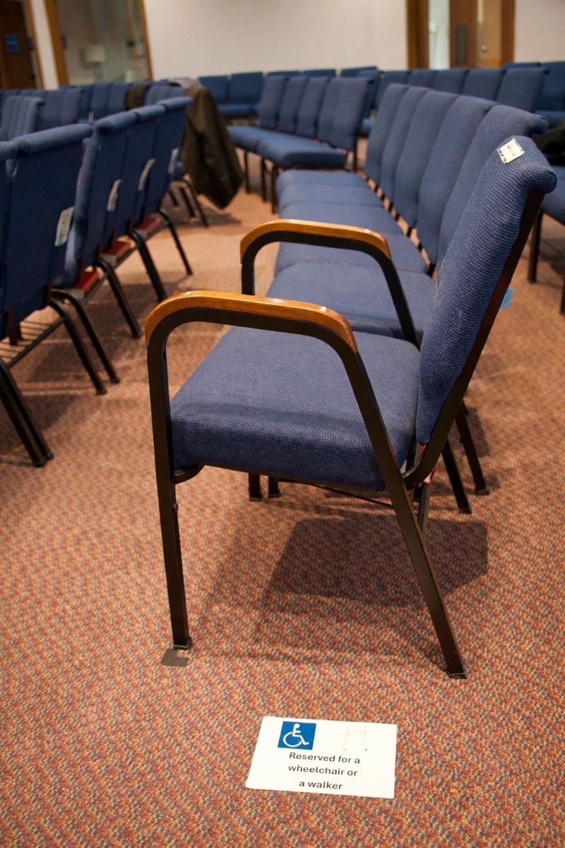 Chairs with arms are available in the sanctuary, especially on aisles