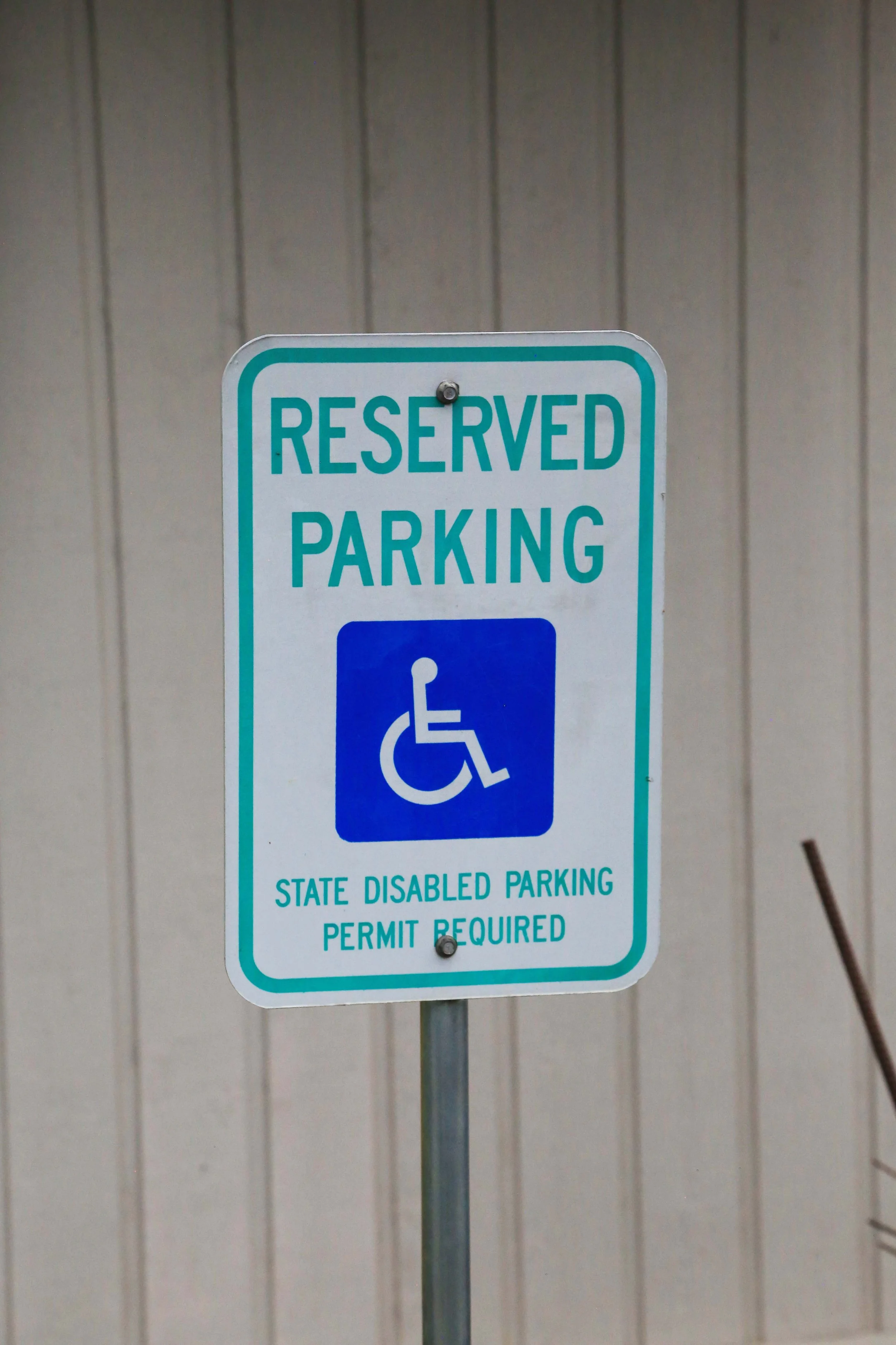 Four parking spaces are reserved for cars with disabled parking permits.