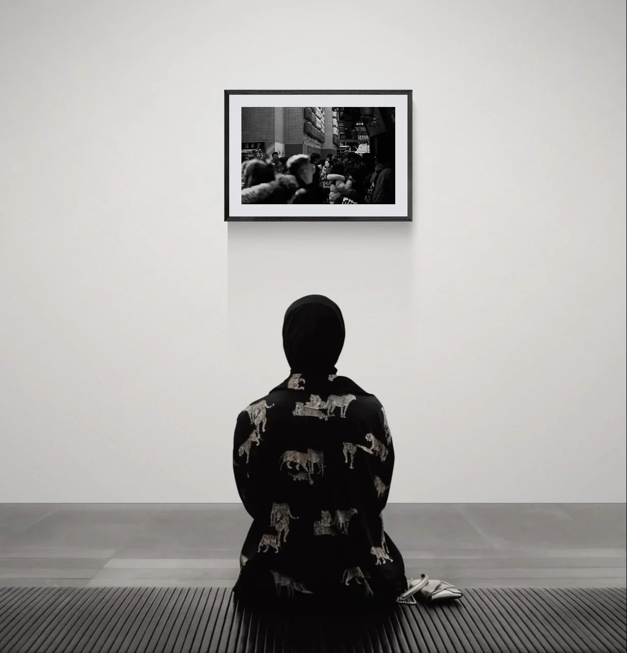 Woman sitting on a bench in an art gallery.jpeg