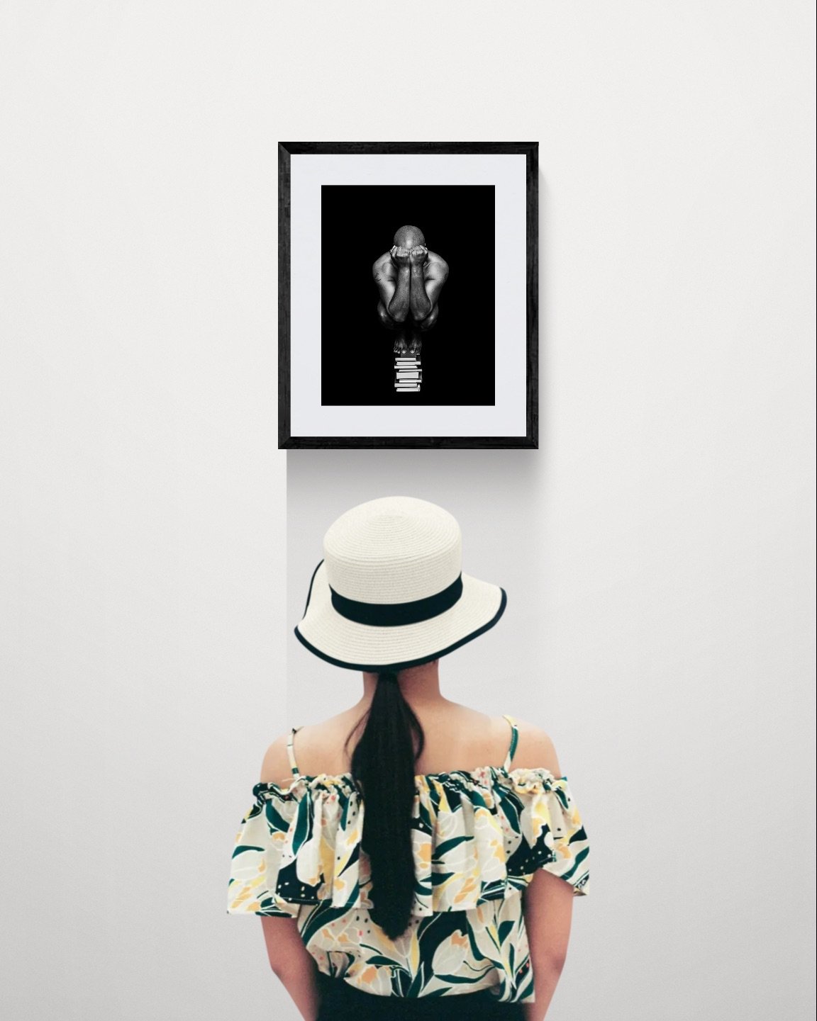 Young woman looking at a gallery wall.jpeg