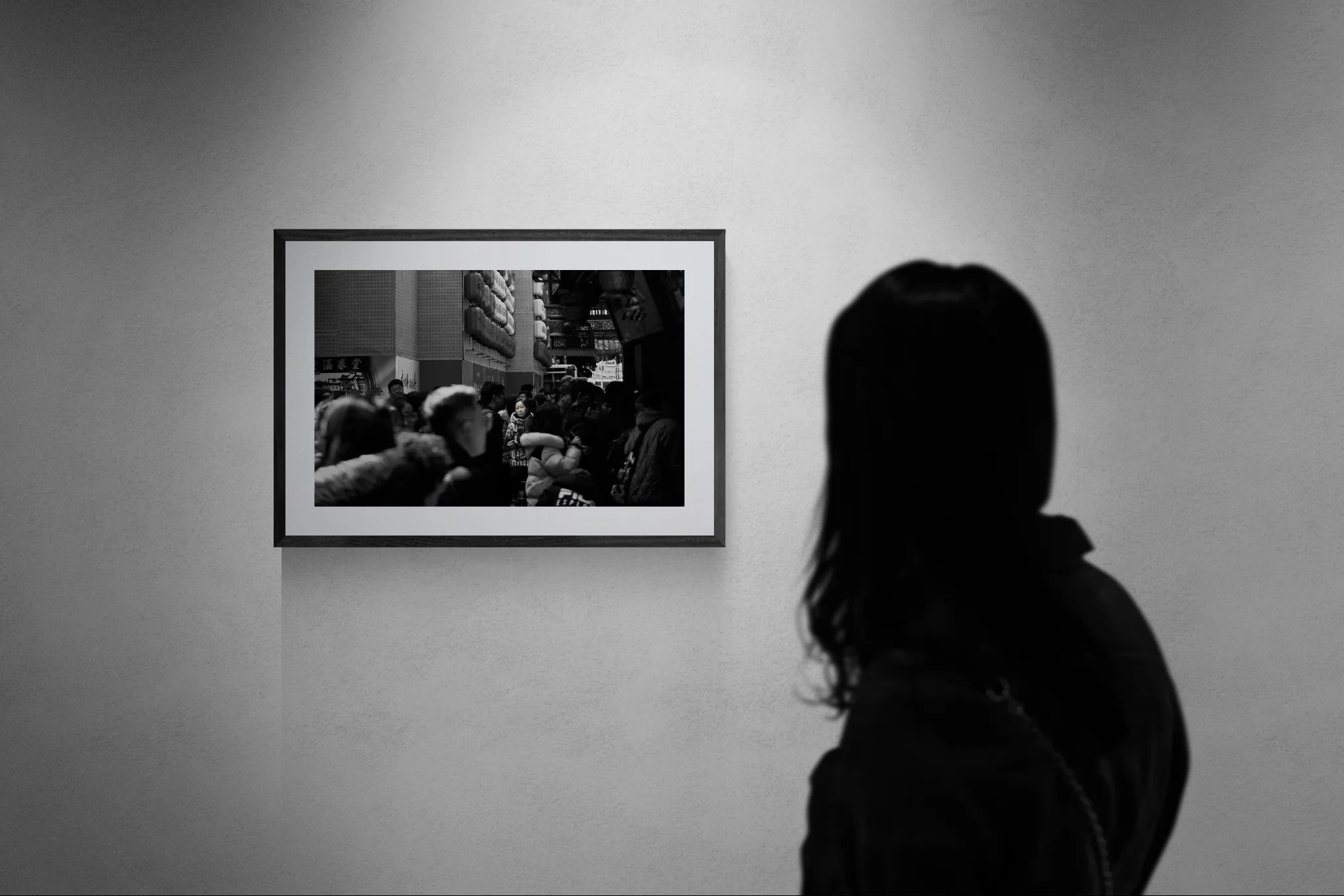 Woman looking at gallery wall.jpeg