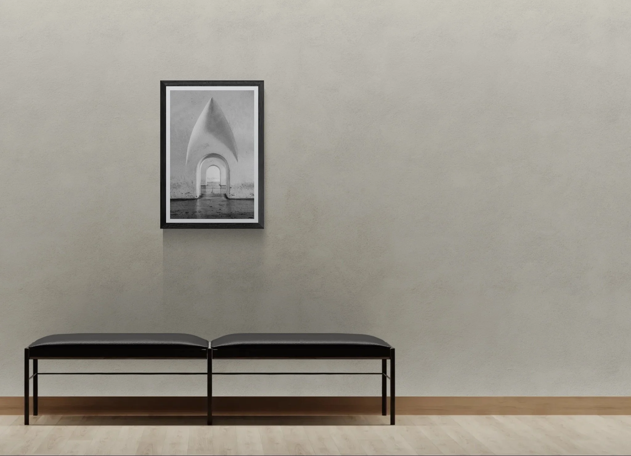 Padded bench seat next to a gallery wall.jpeg