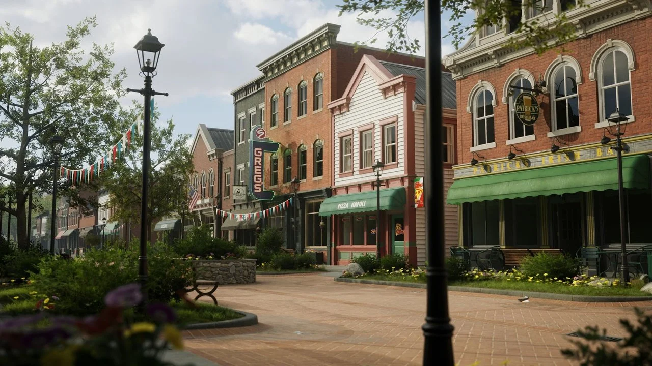 Empty street in Sycamore Grove with brick buildings, historic-style lampposts, and bunting flags strung across the street.