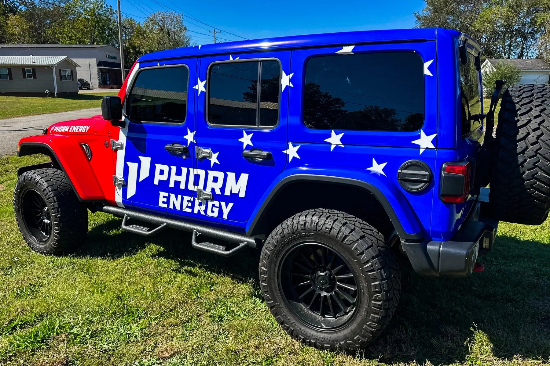 A blue and red Jeep with 
