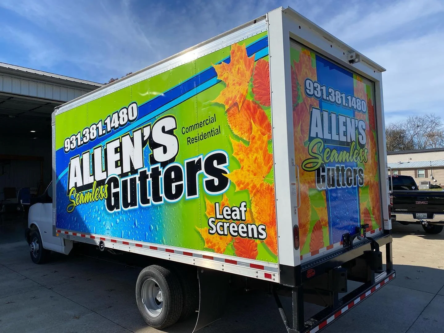 Colorful truck advertisement for Allen's Seamless Gutters with leaves and leaf screens design, phone number 931.381.1480, highlights commercial and residential gutter services.