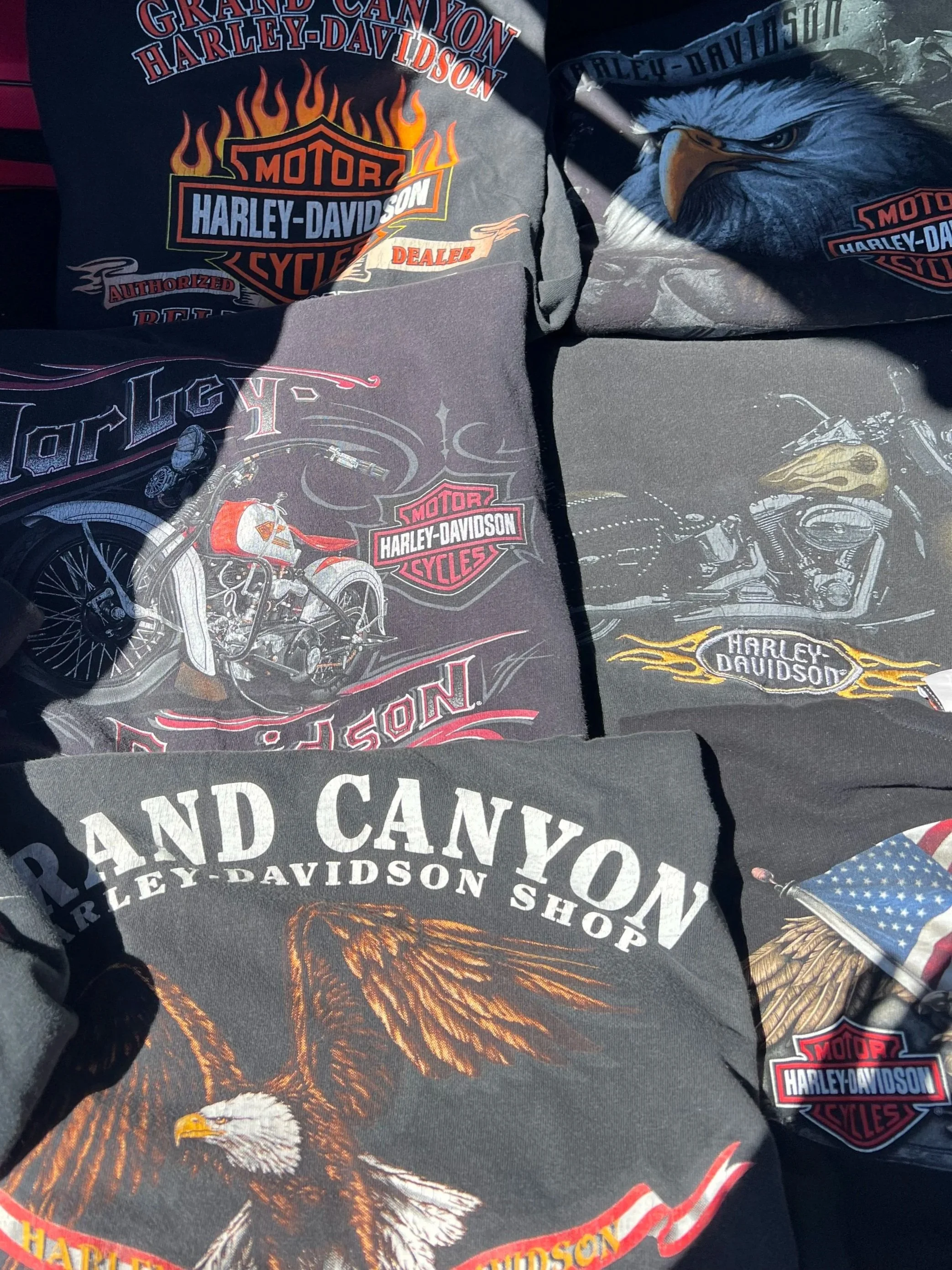 Vintage Harley-Davidson graphic T-shirts featuring motorcycle, eagle and Harley-Davidson designs.