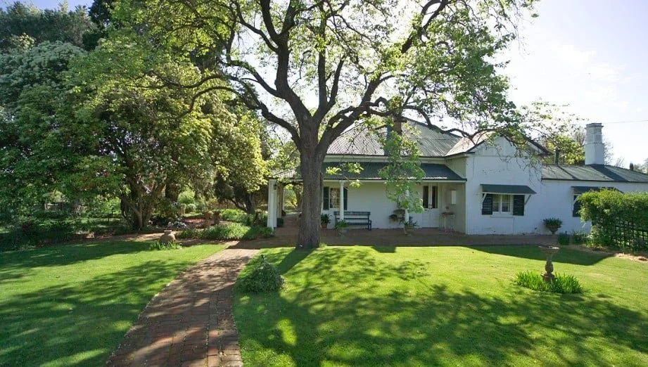 Miss Traill's House framed by the garden