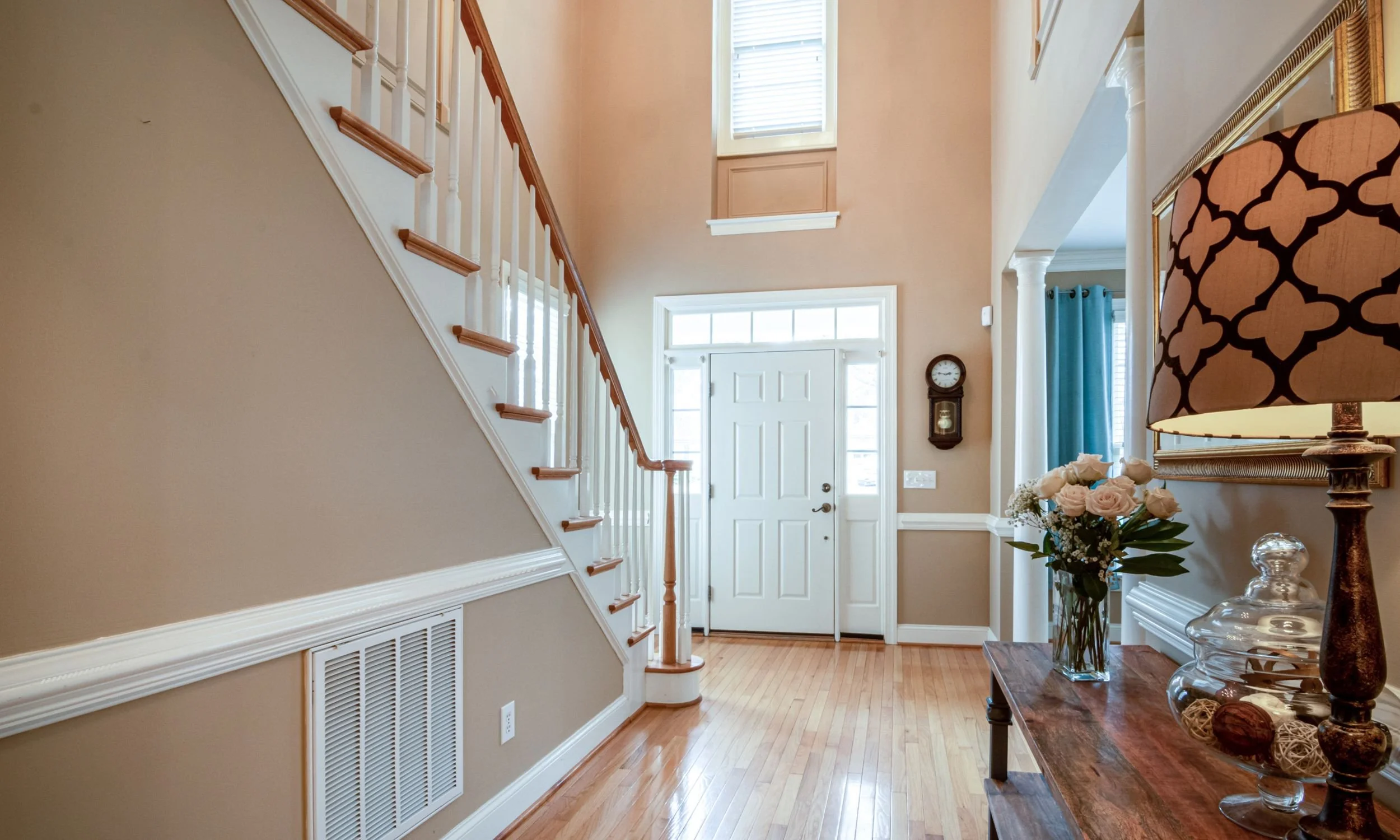 real estate home entry with stair railing