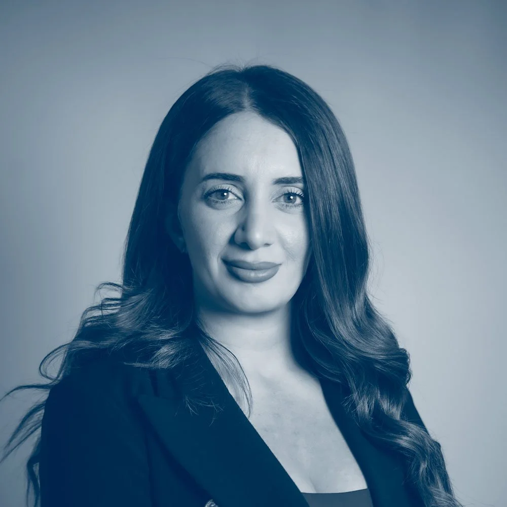A woman with long, wavy hair smiling at the camera, wearing a dark top against a neutral background. Sandra Dickson founder and owner of Full Scope Finance PTY LTD