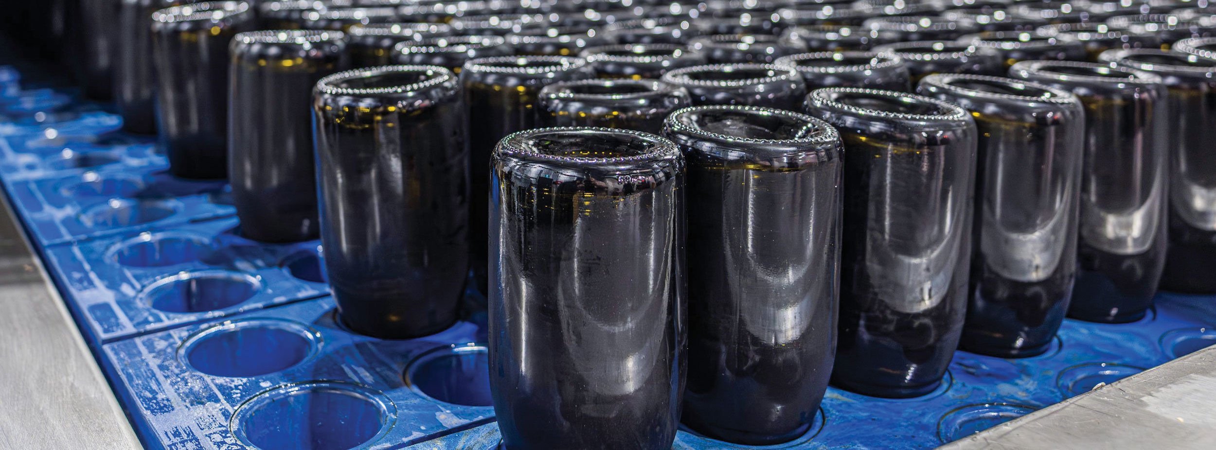 Kilchurn sparkling wine bottles being stored vertically with lees in neck of bottle ready for disgorging