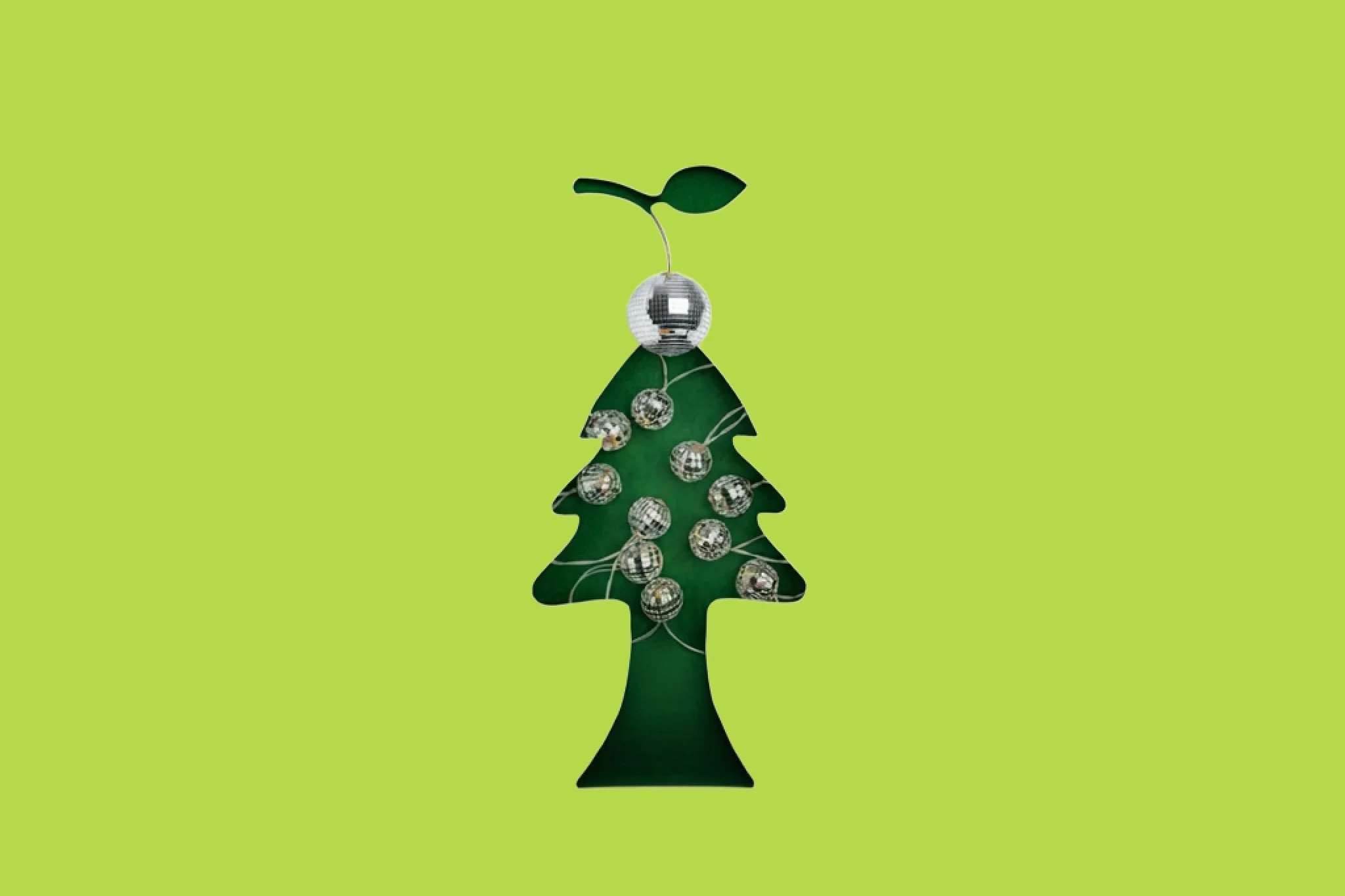 A green paper cutout of a Christmas tree decorated with small disco ball ornaments and topped with a larger disco ball with a leaf on top, set against a bright green background. Image for Singles Sessions (Individual Therapy) at CouplesTherapy.co.