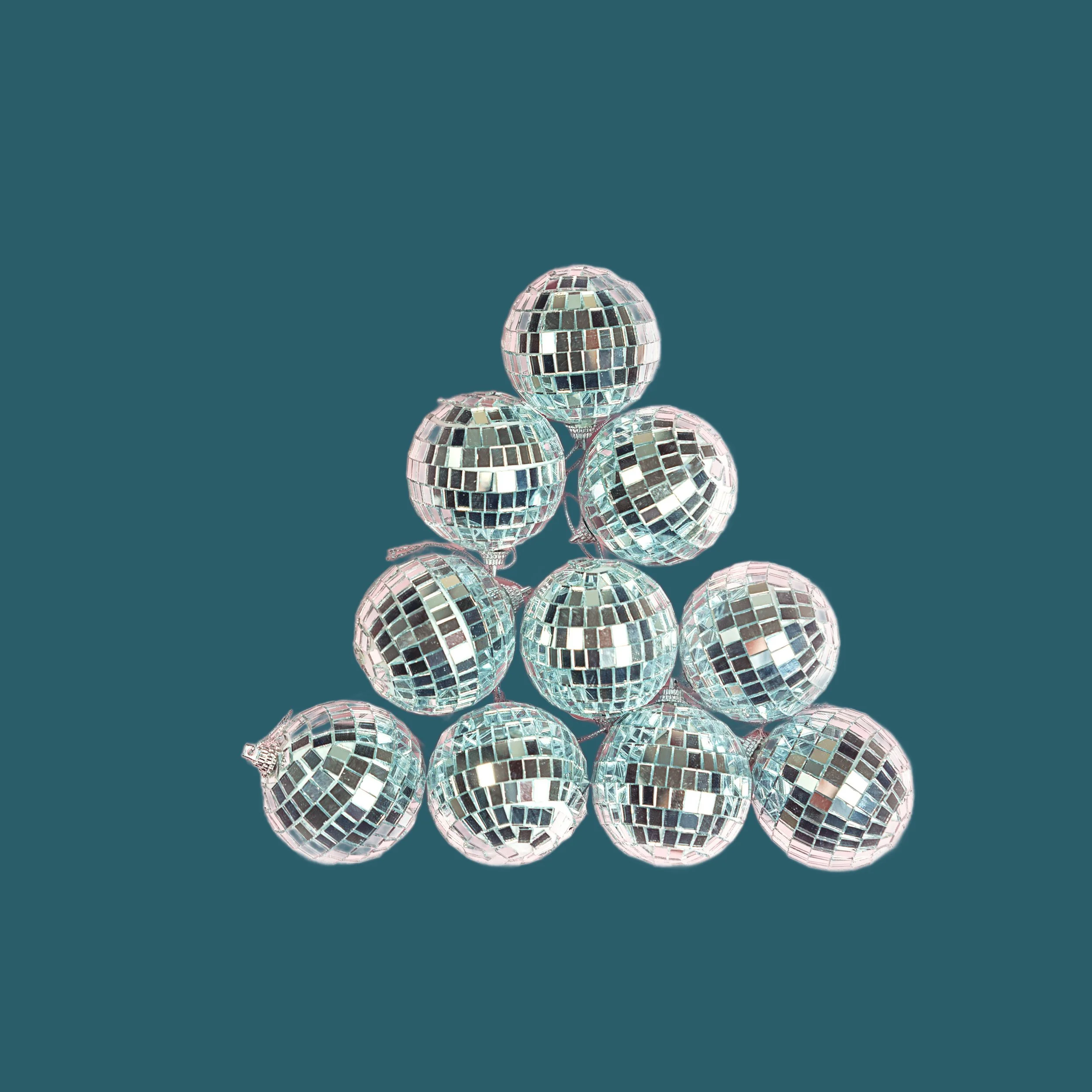 A pyramid of 10 small disco balls arranged against a solid teal background.  Image for The Relationship Skills CLASS™ at CouplesTherapy.co.