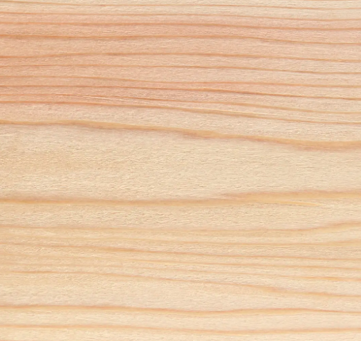 Close-up of a wooden surface with visible grain and light color.