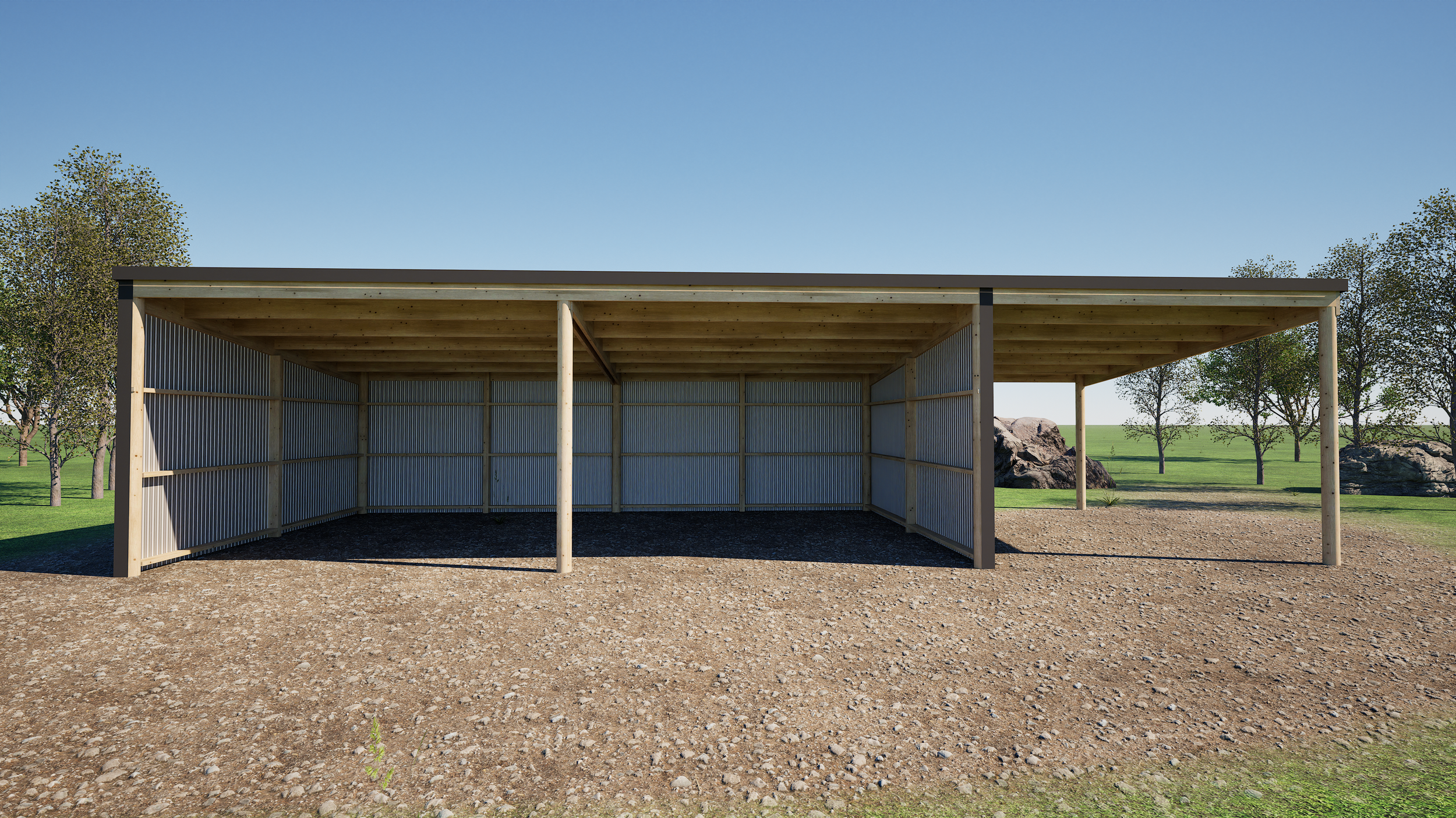 A simple wooden outdoor shelter with a corrugated metal side wall and open on three sides, situated on a dirt ground with a grassy landscape and trees in the background under a clear blue sky.