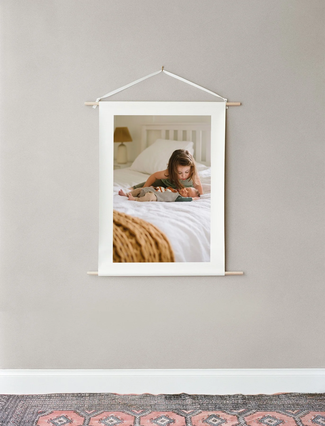 Printed photo by Golden and Co Photography hanging on a grey wall.