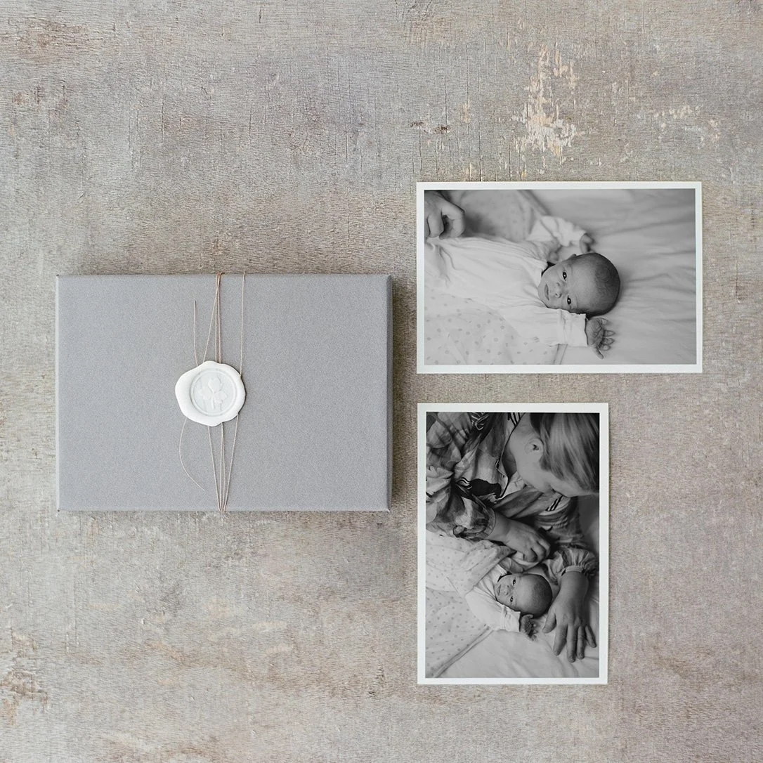 Photo prints by Golden and Co lying on a concrete floor.