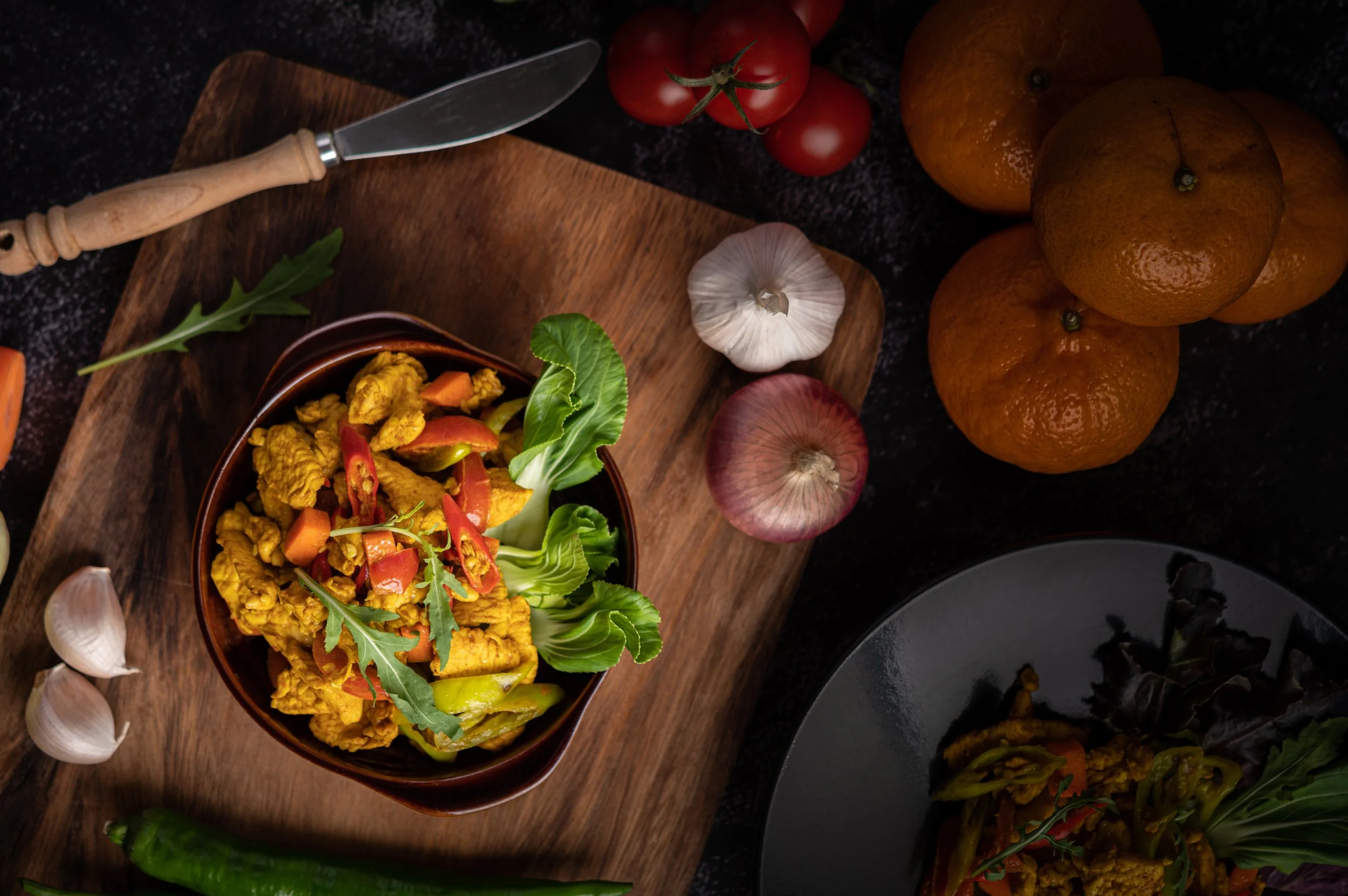 chicken-stir-fried-chili-along-with-bell-pepper-tomatoes-carrots.jpg