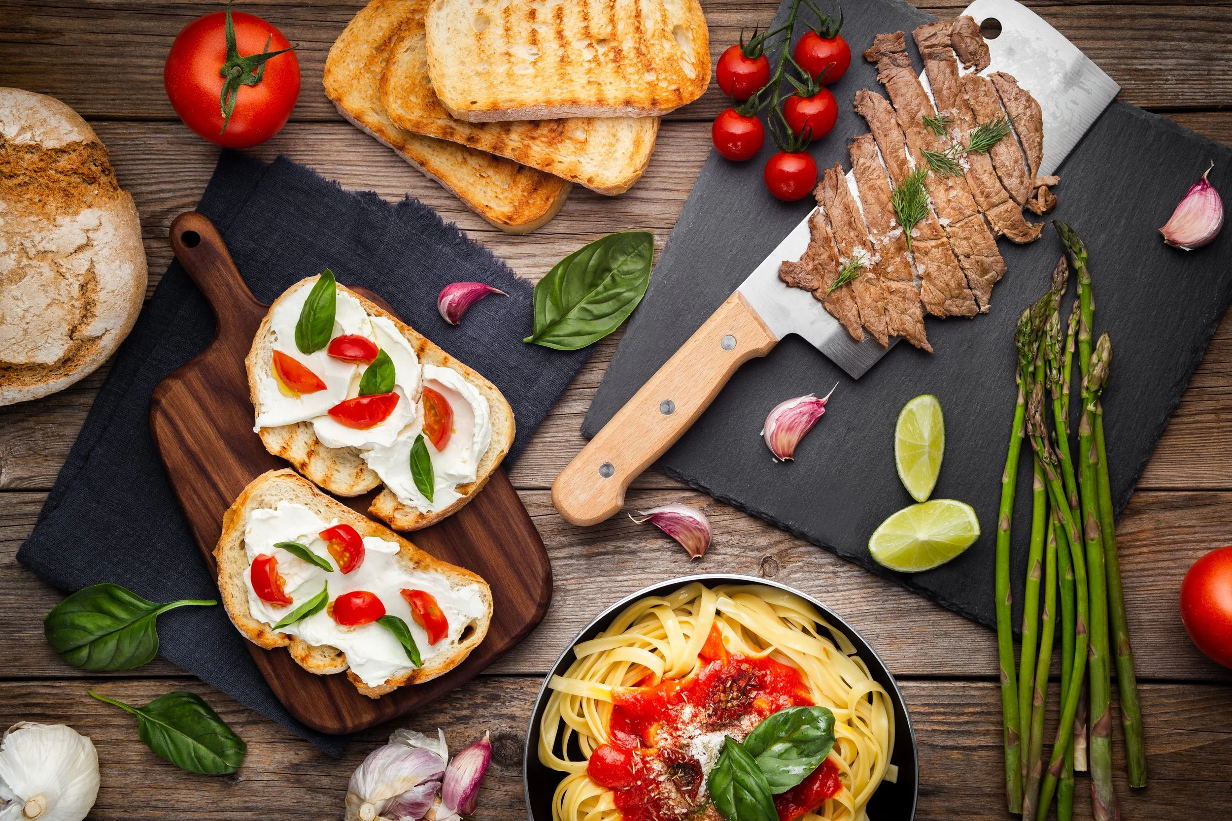 kitchen-table-with-ready-dishes-ingredients.jpg