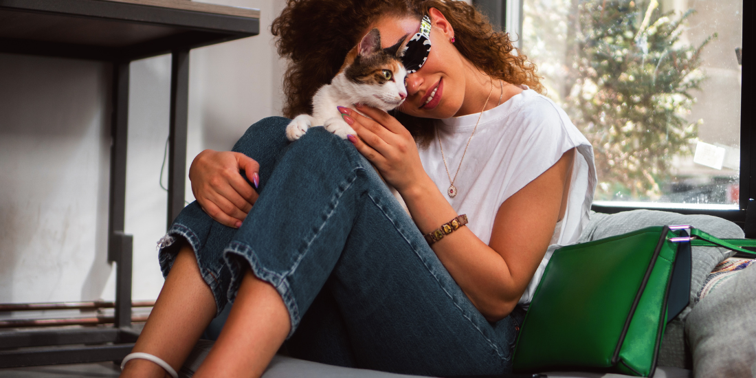 Animal advocate spending time with a rescued cat