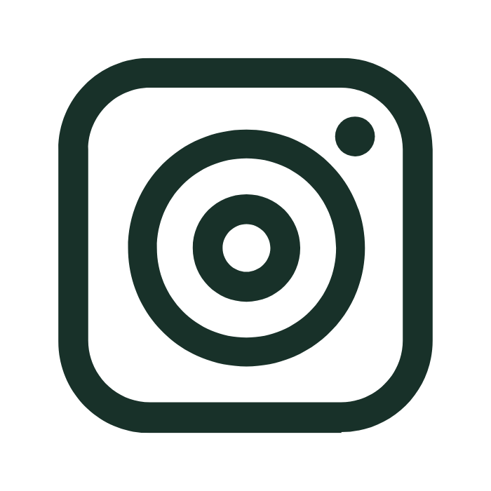 Icon of a vintage camera outline in black.