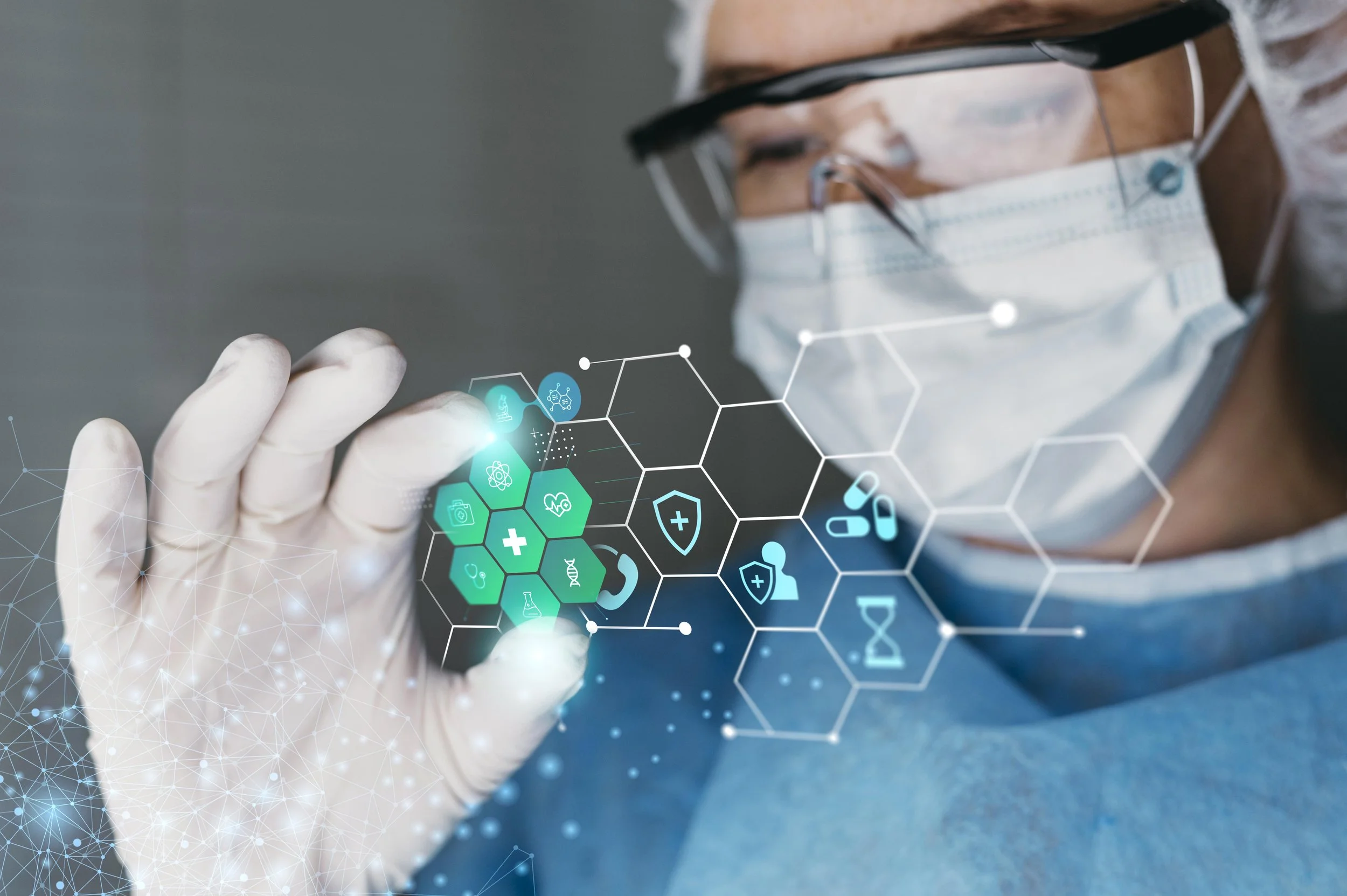 A healthcare professional wearing a surgical mask, gloves, and glasses interacts with a virtual digital interface containing medical icons, including a heart, DNA strand, and pills.